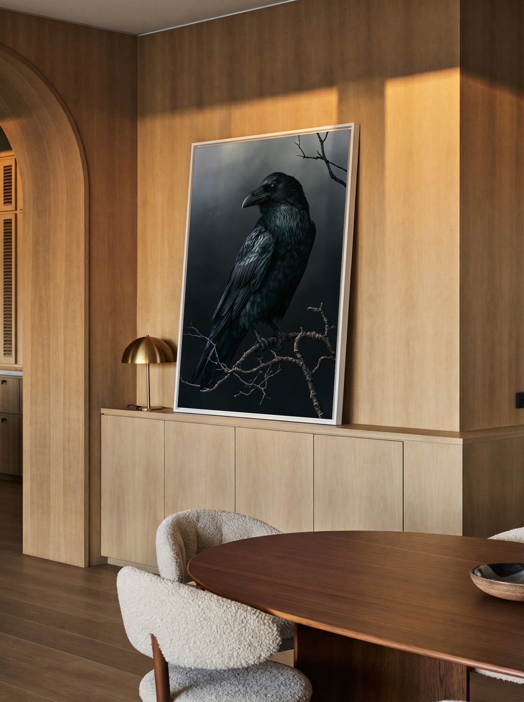 dark raven on bare winter branch canvas wall art in a white frame in a styled room setting