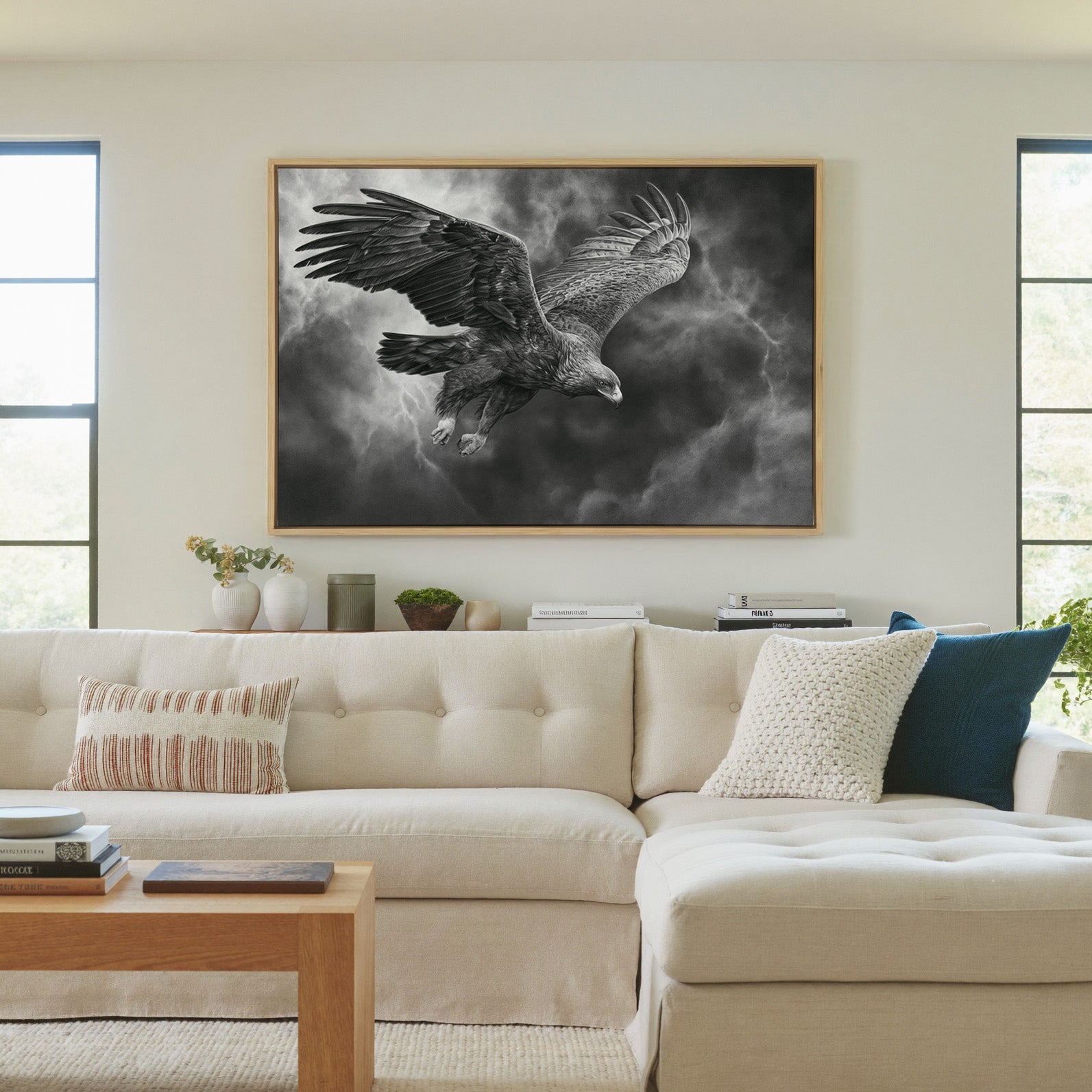 golden eagle in a steep dive through storm canvas wall art in a natural wood frame in a living room