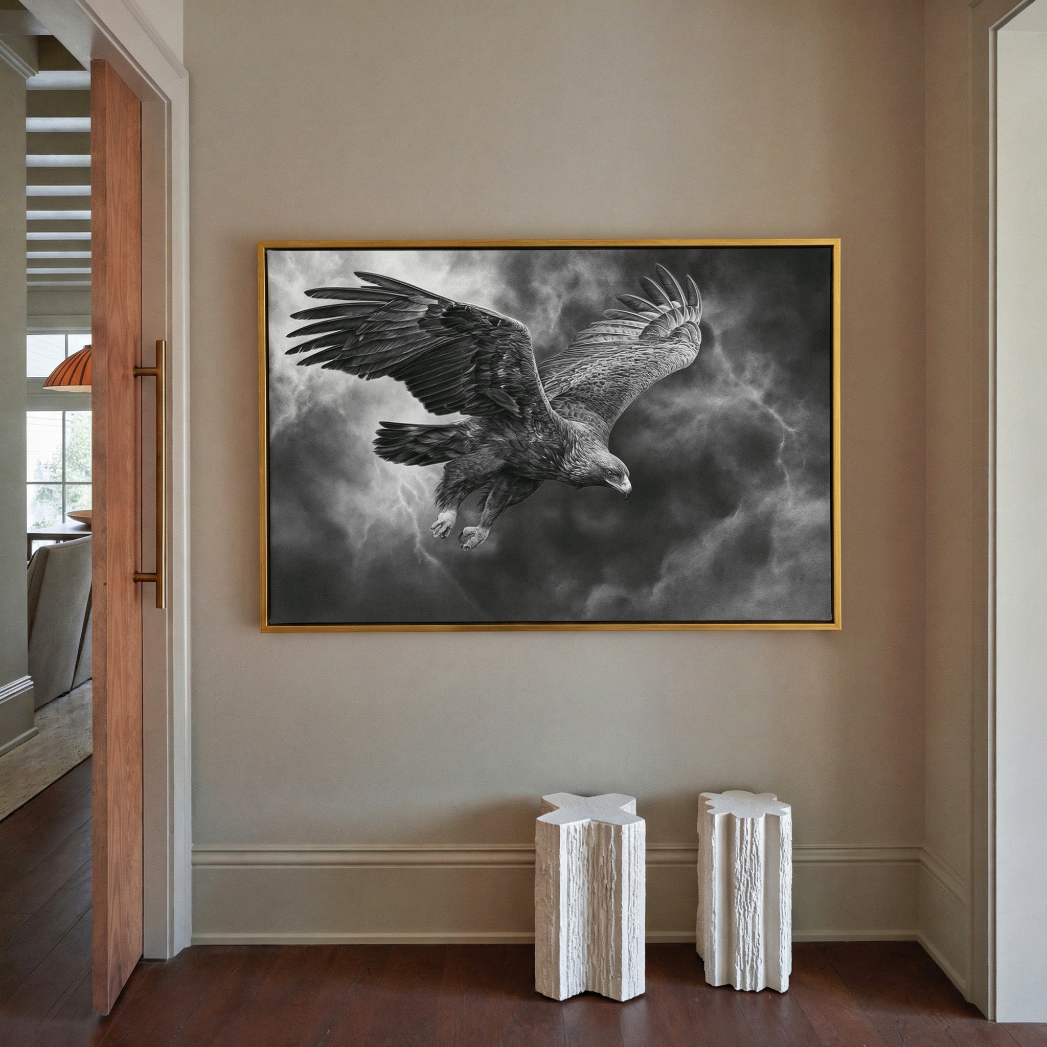 golden eagle in a steep dive through storm canvas wall art in a gold frame in a styled room setting