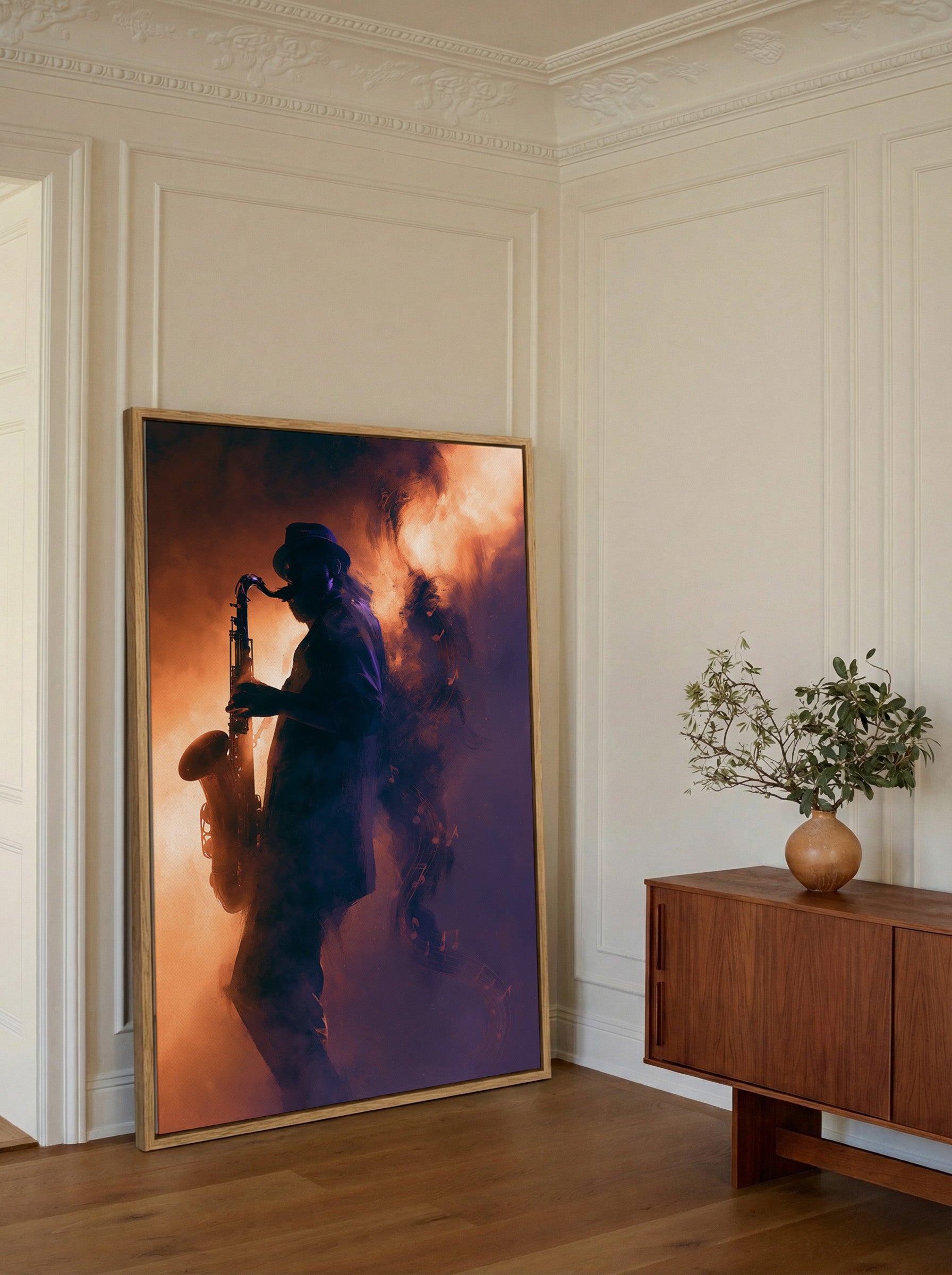 silhouetted saxophone player in orange and canvas wall art in an oak frame in a styled room setting