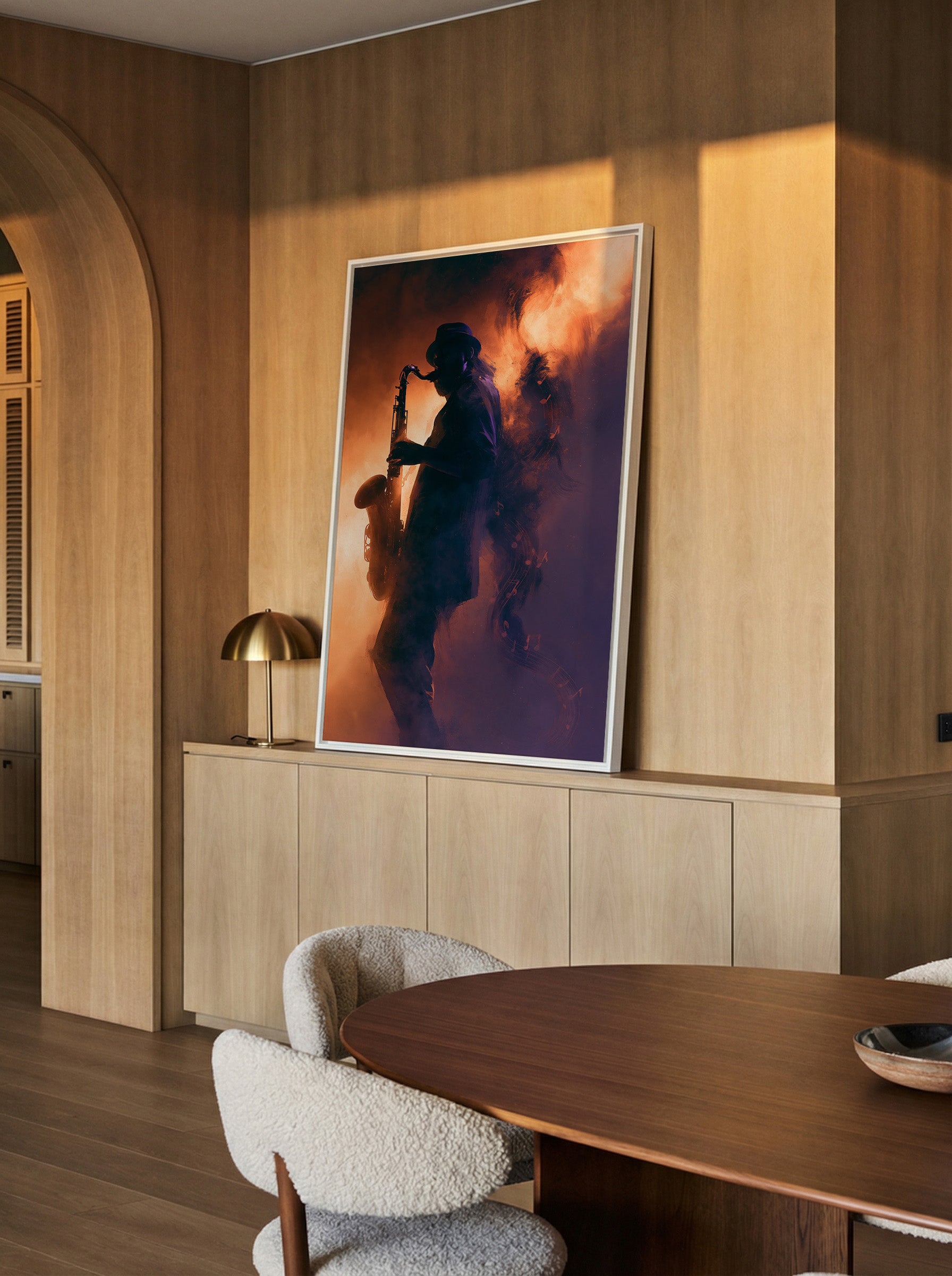 silhouetted saxophone player in orange and canvas wall art in a white frame in a styled room setting
