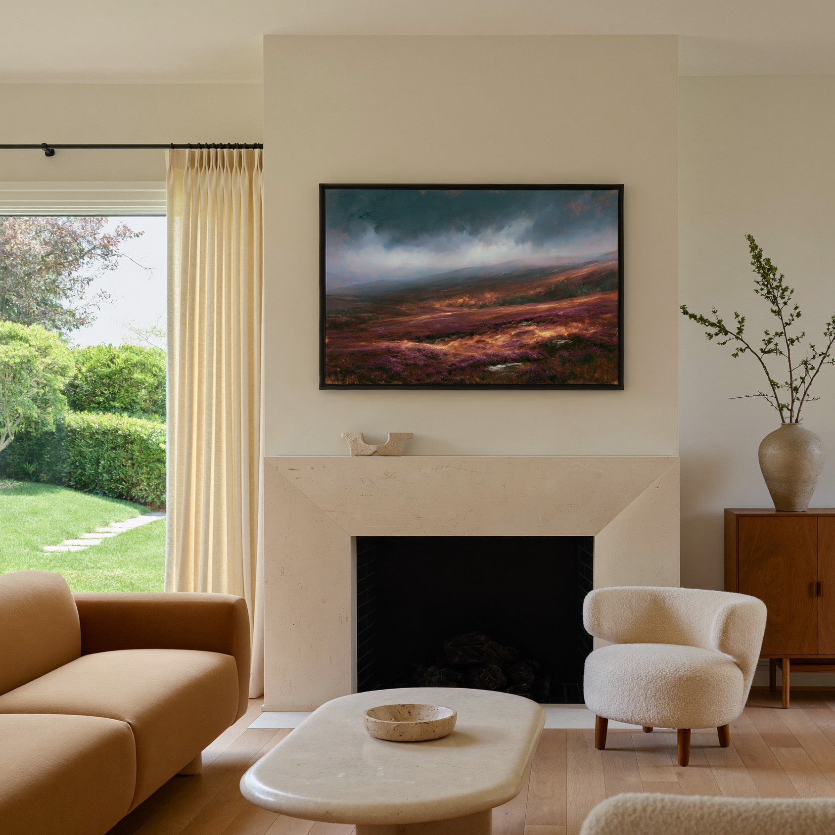 late autumn heather hills under a stormy sky canvas wall art in a black frame above a mantel