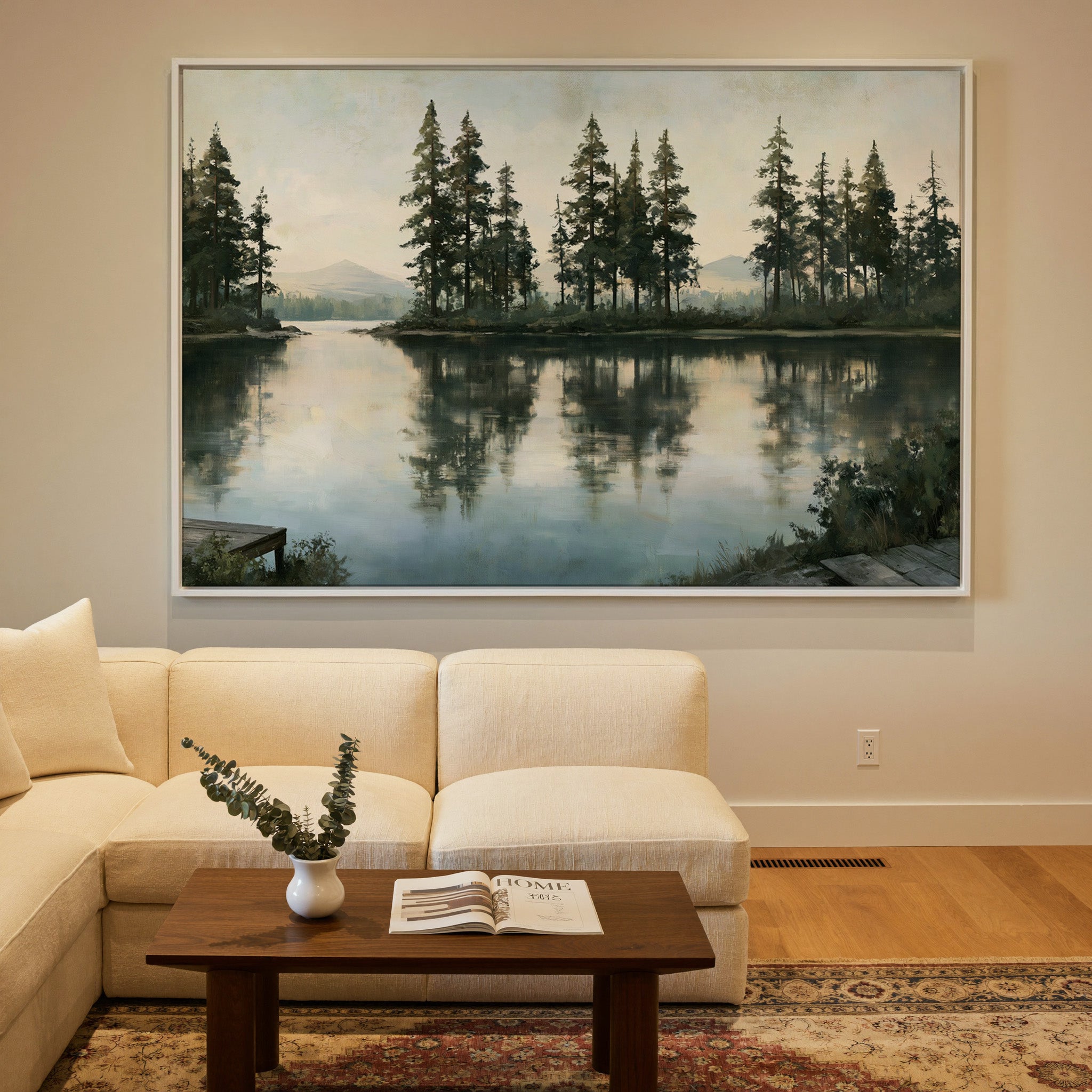 quiet lake with tall pines and pale distant canvas wall art in a white frame in a styled room setting