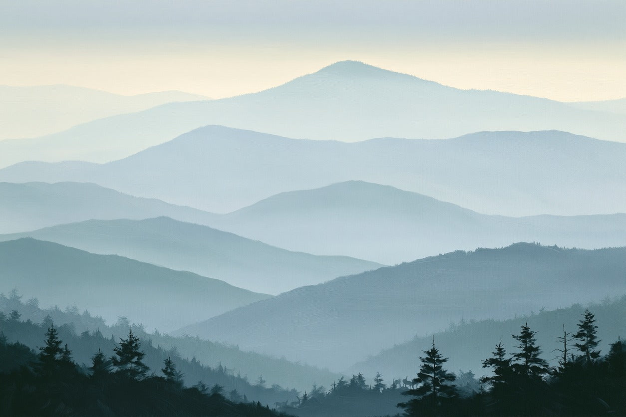 Layered blue mountain ridges fading into mist with dark pine silhouettes along the bottom edge
