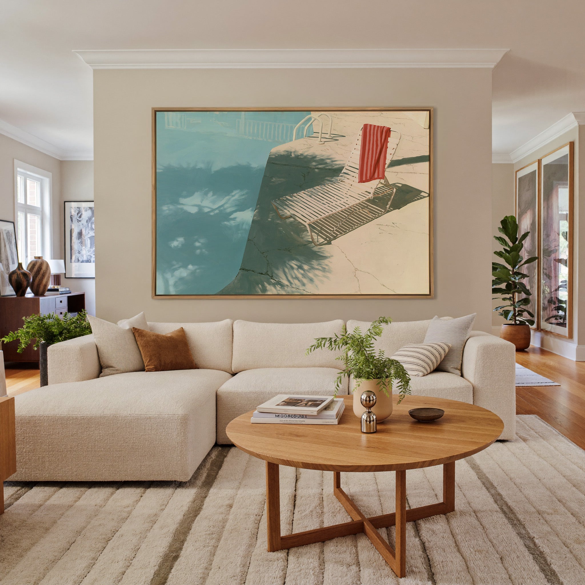 sunlit turquoise pool with striped lounge chair canvas wall art in an oak frame in a living room