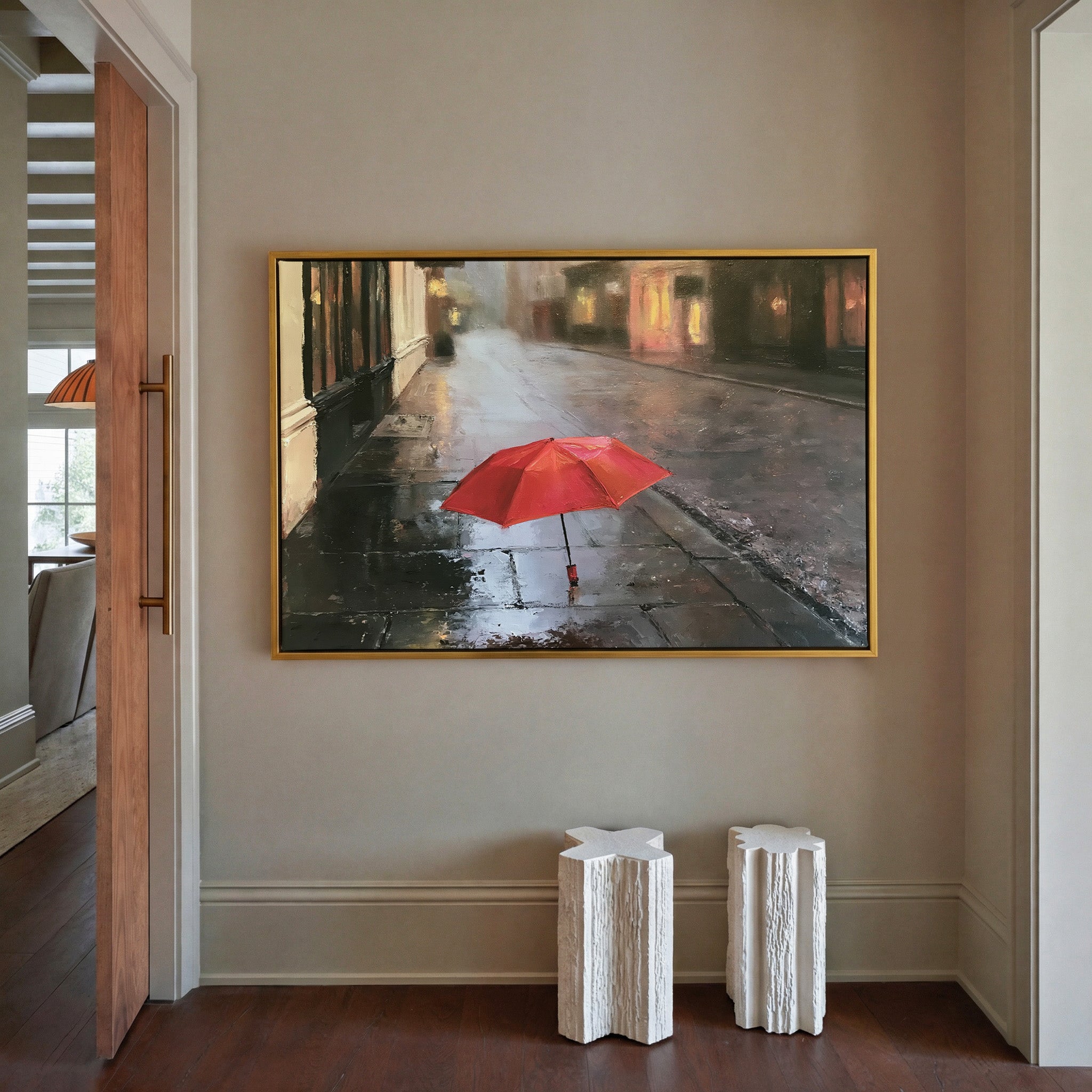 small red umbrella on a wet sidewalk canvas wall art in a gold frame in a styled room setting
