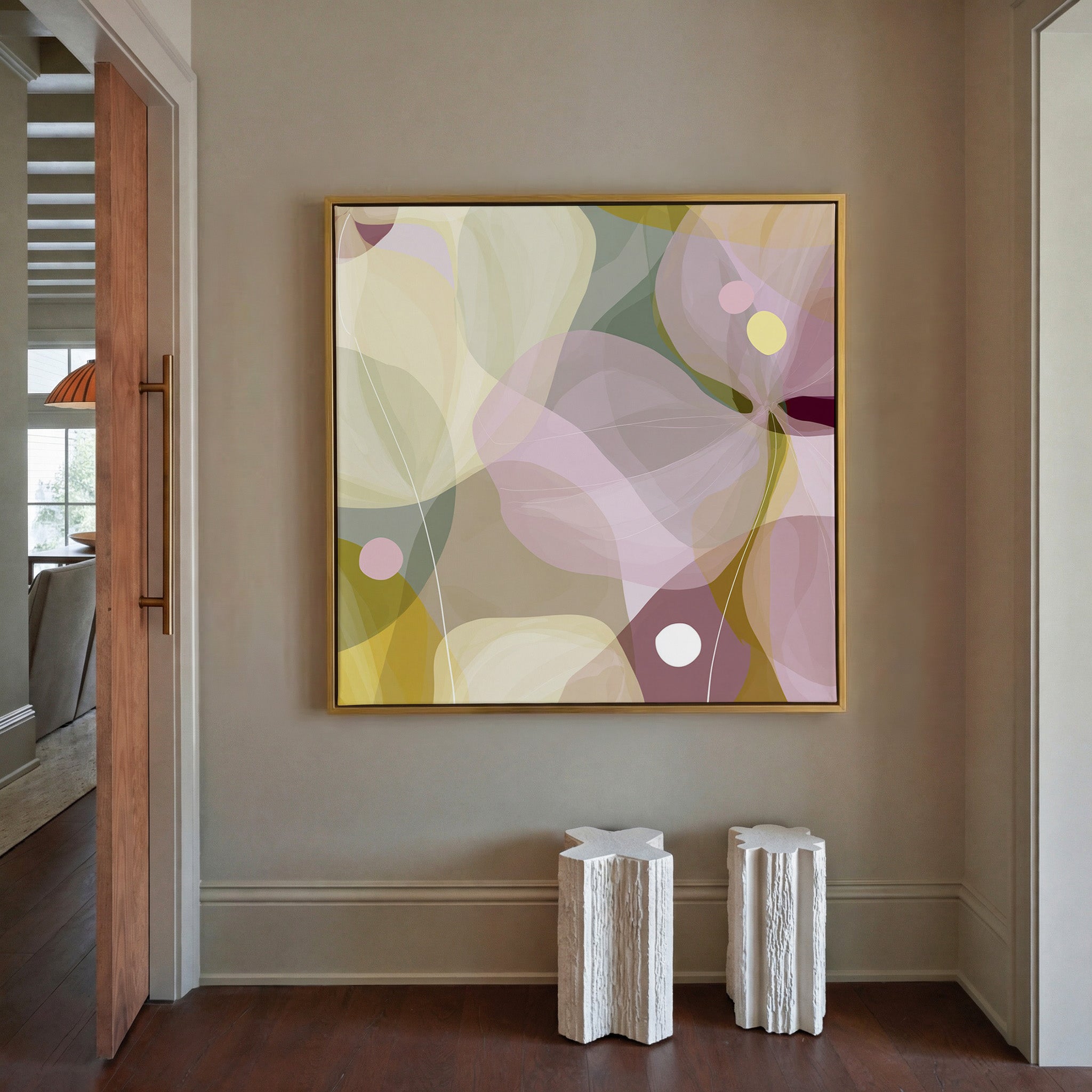 soft translucent petals in blush, cream, and canvas wall art in a gold frame in a styled room setting