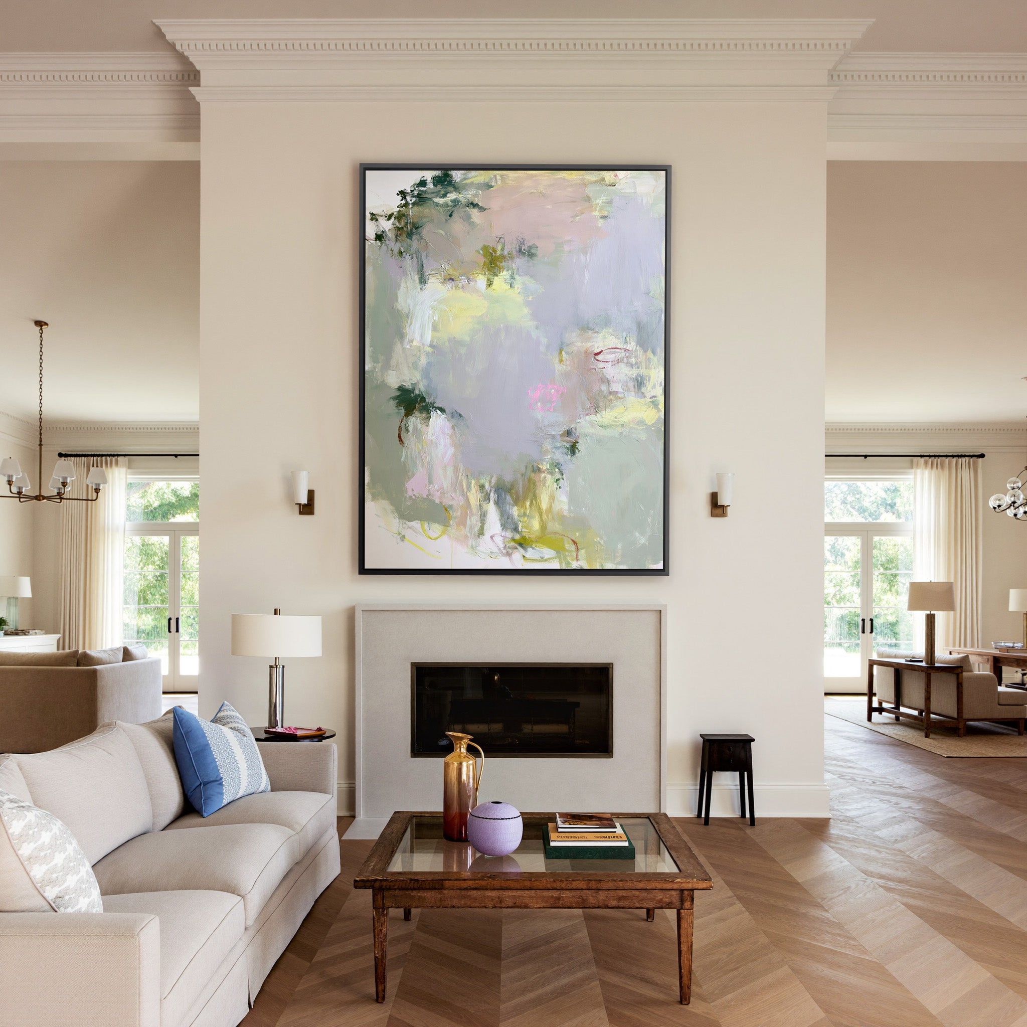 soft pastel abstract with pale lilac, blush, canvas wall art in a black frame above a mantel