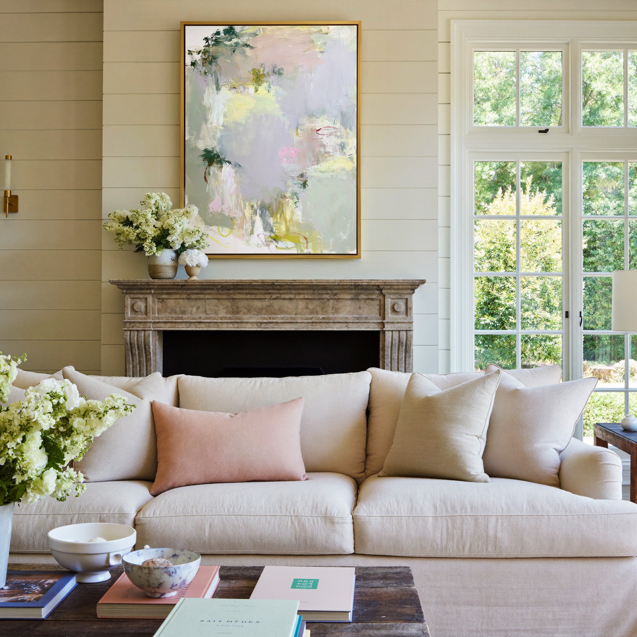 soft pastel abstract with pale lilac, blush, canvas wall art in a gold frame above a mantel