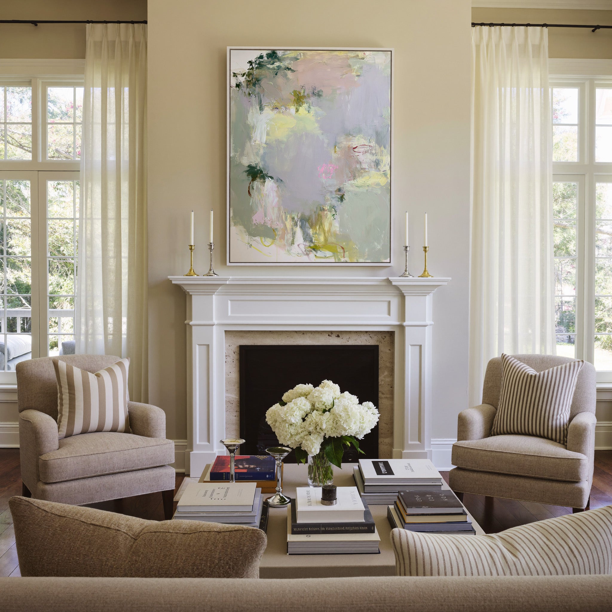 soft pastel abstract with pale lilac, blush, canvas wall art in a white frame above a mantel