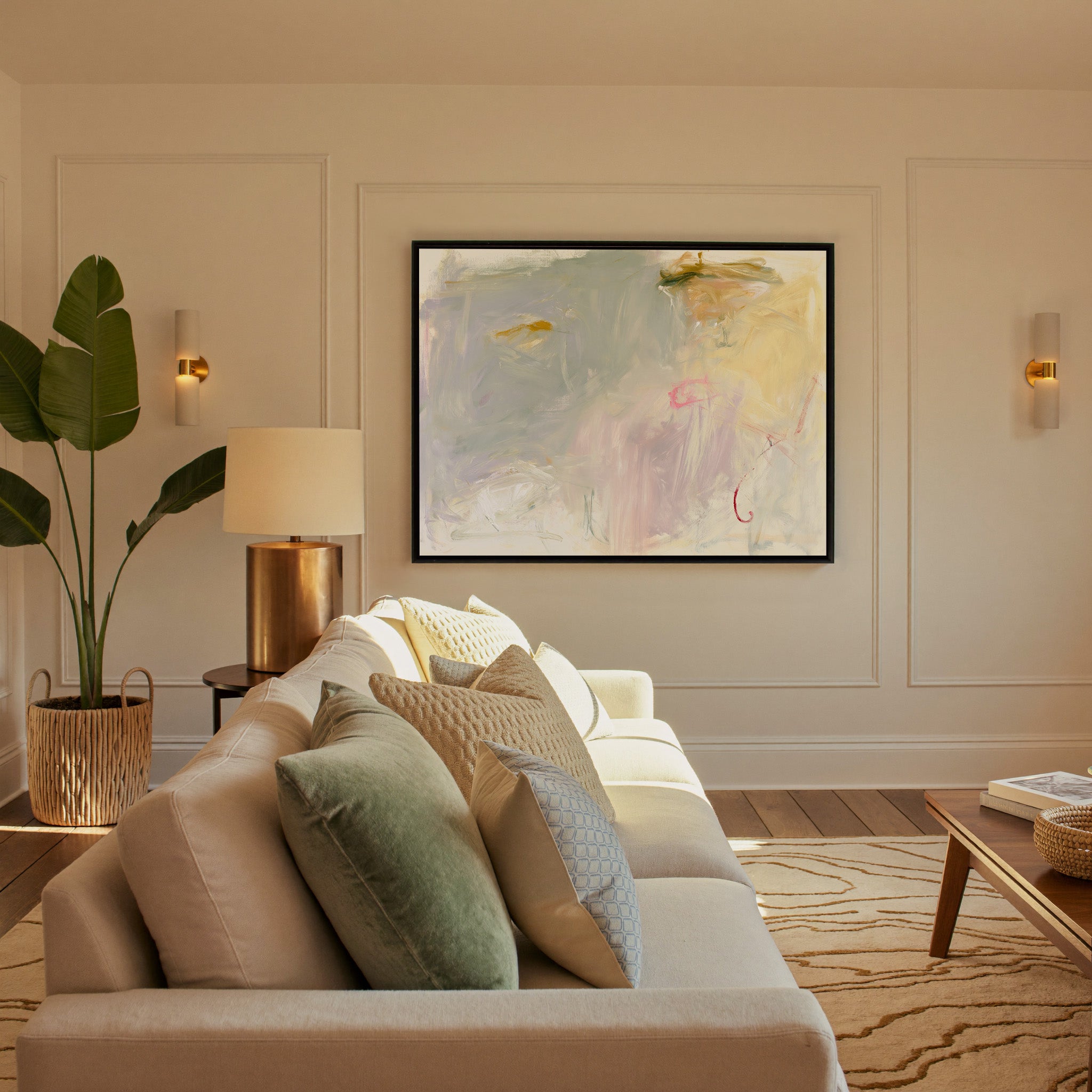 pale cream, blush, and sage abstract canvas wall art in a black frame in a styled room setting