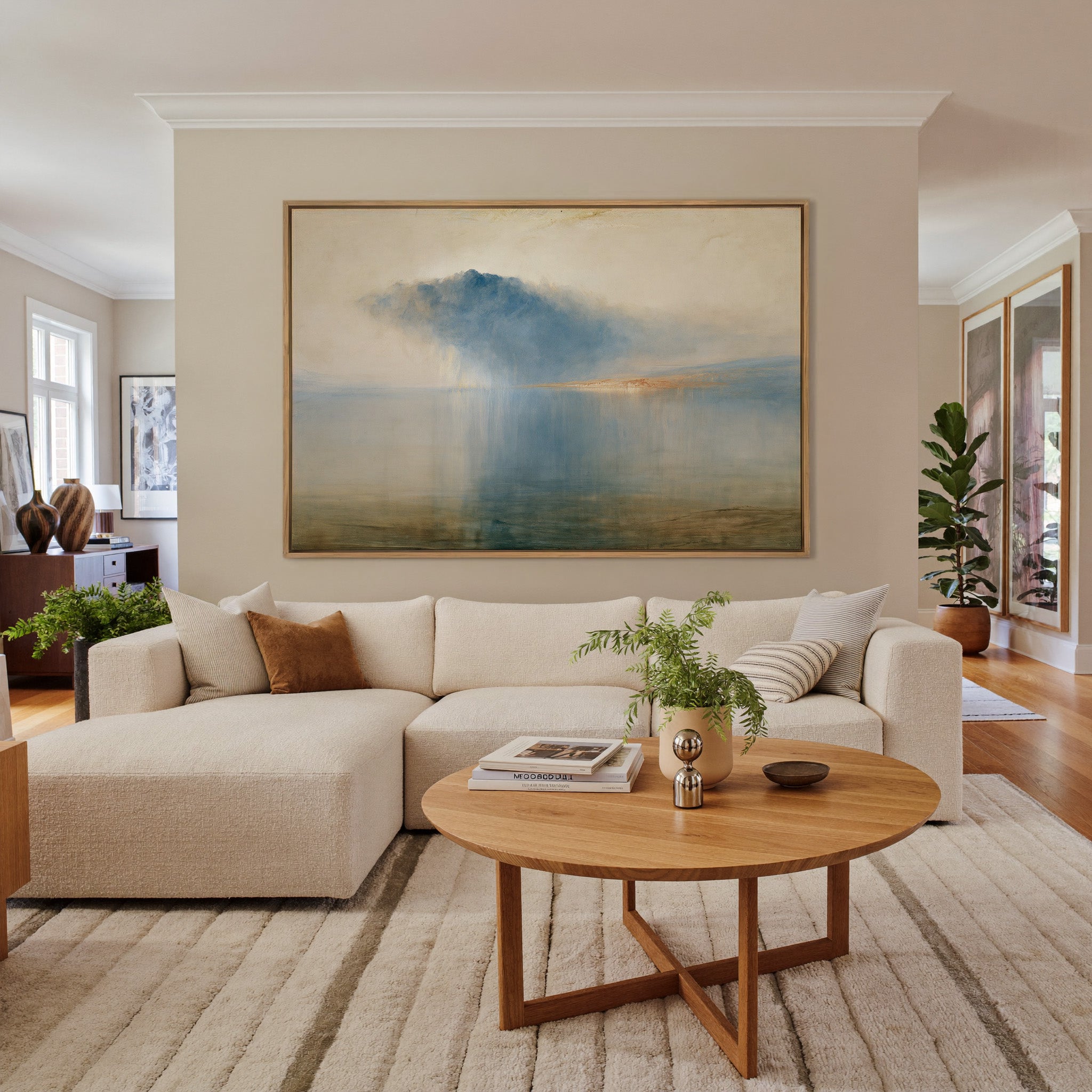 blue storm cloud over still water canvas wall art in an oak frame in a living room