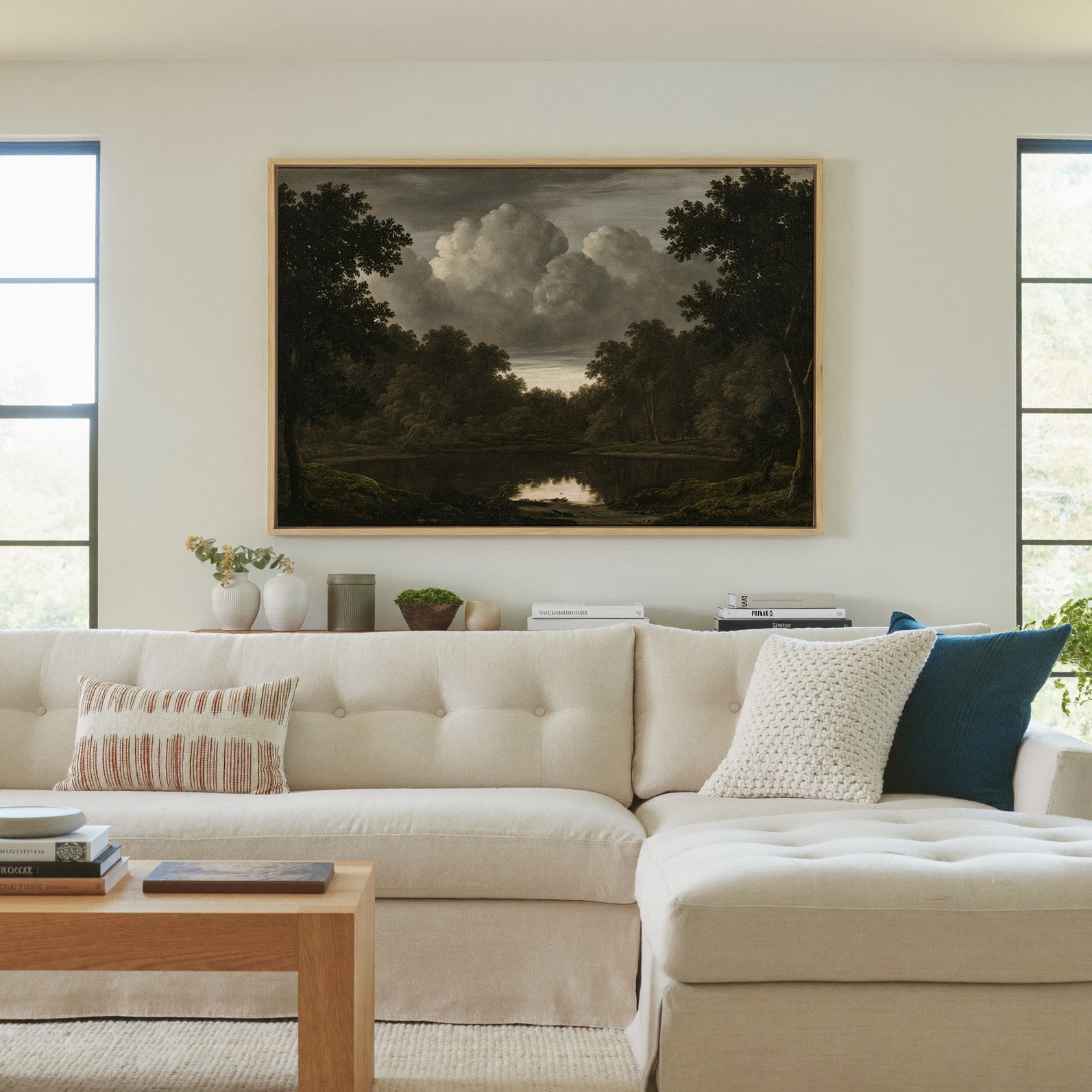 dark woodland pool beneath heavy storm clouds canvas wall art in a natural wood frame in a living room