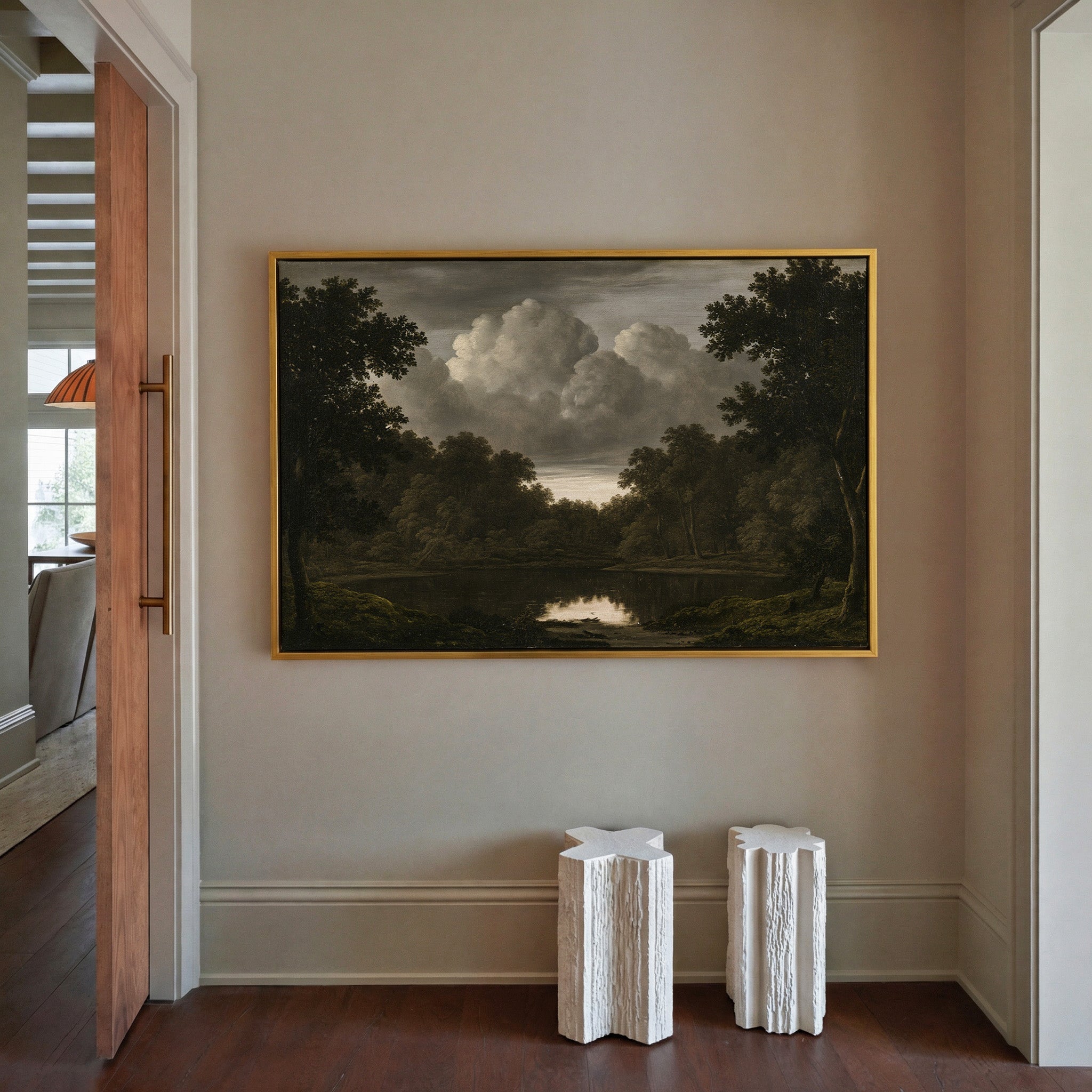 dark woodland pool beneath heavy storm clouds canvas wall art in a gold frame in a styled room setting