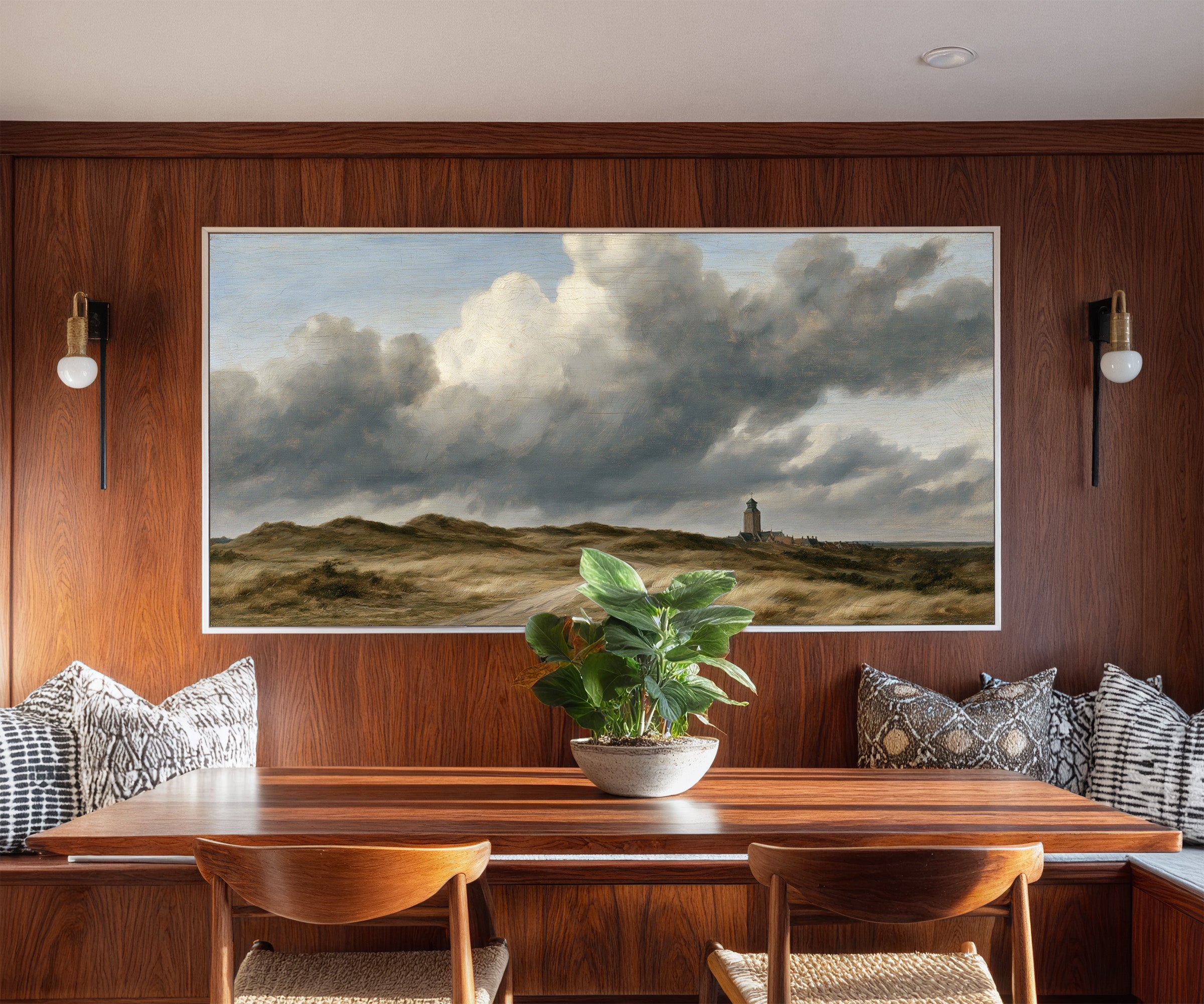 low dunes under towering wind driven clouds canvas wall art in a white frame in a styled room setting