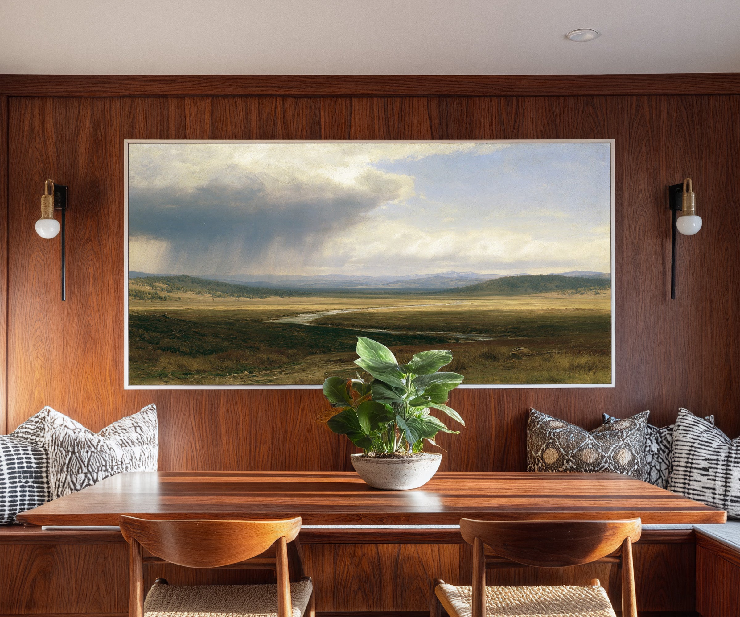 broad plain under a split storm sky canvas wall art in a white frame in a styled room setting