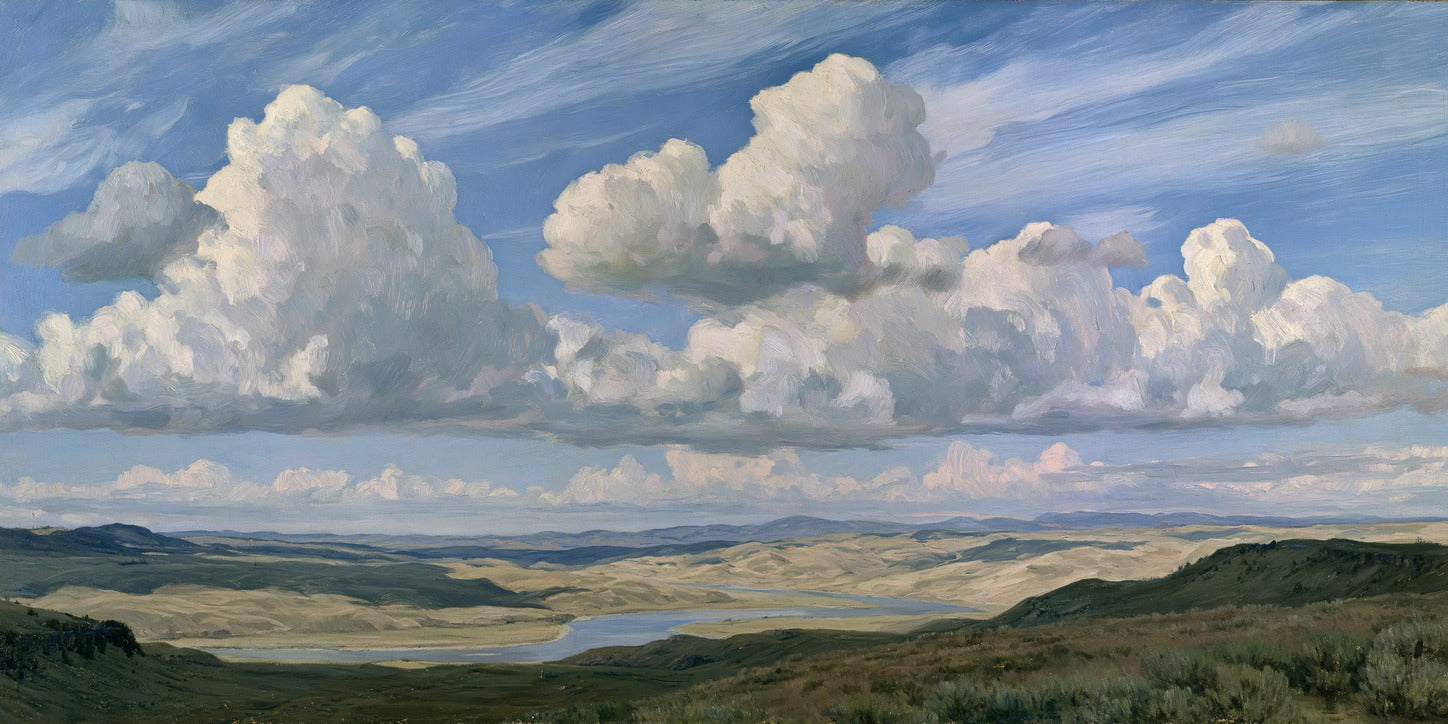 Towering white clouds over a blue sky, layered valley hills, and a winding river below