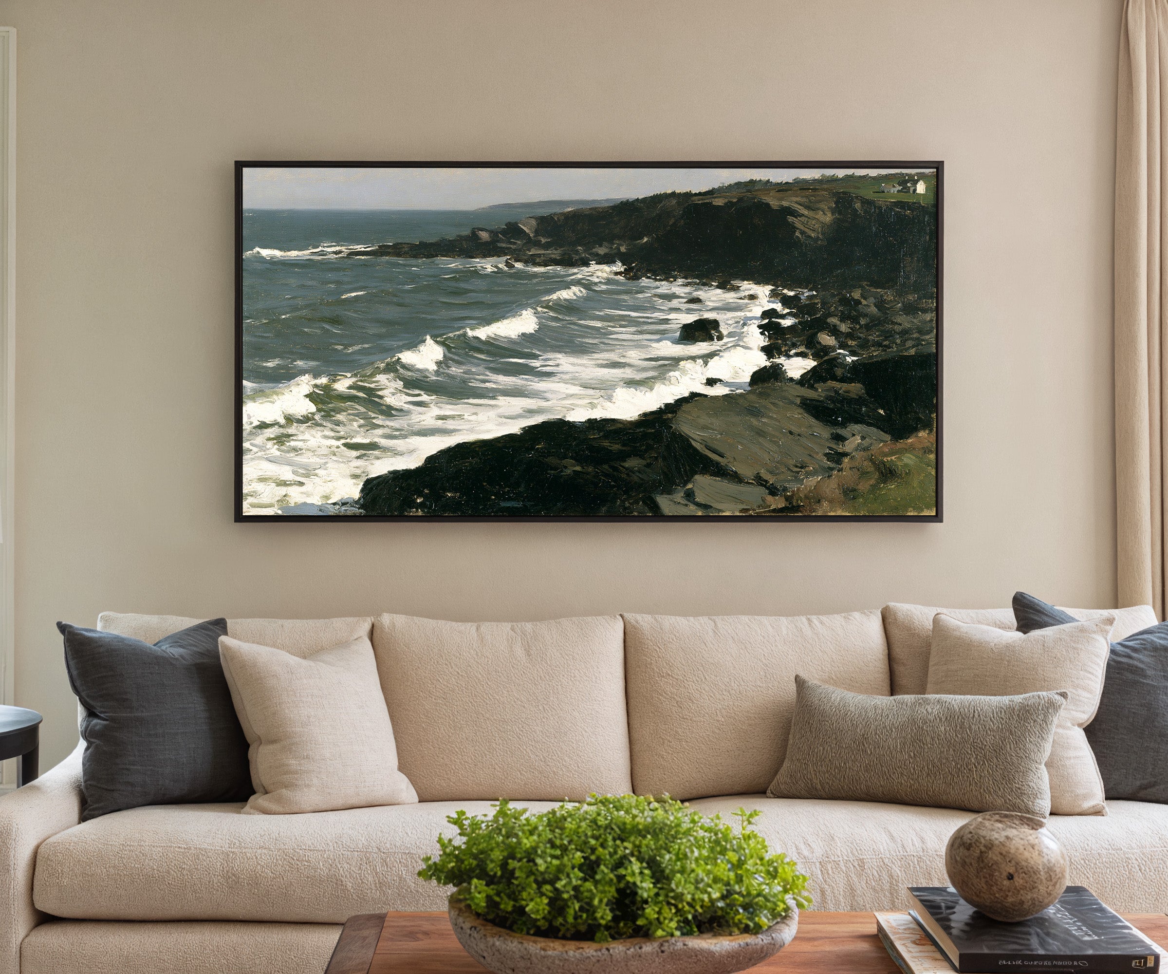 dark headland with white surf canvas wall art in a black frame in a styled room setting