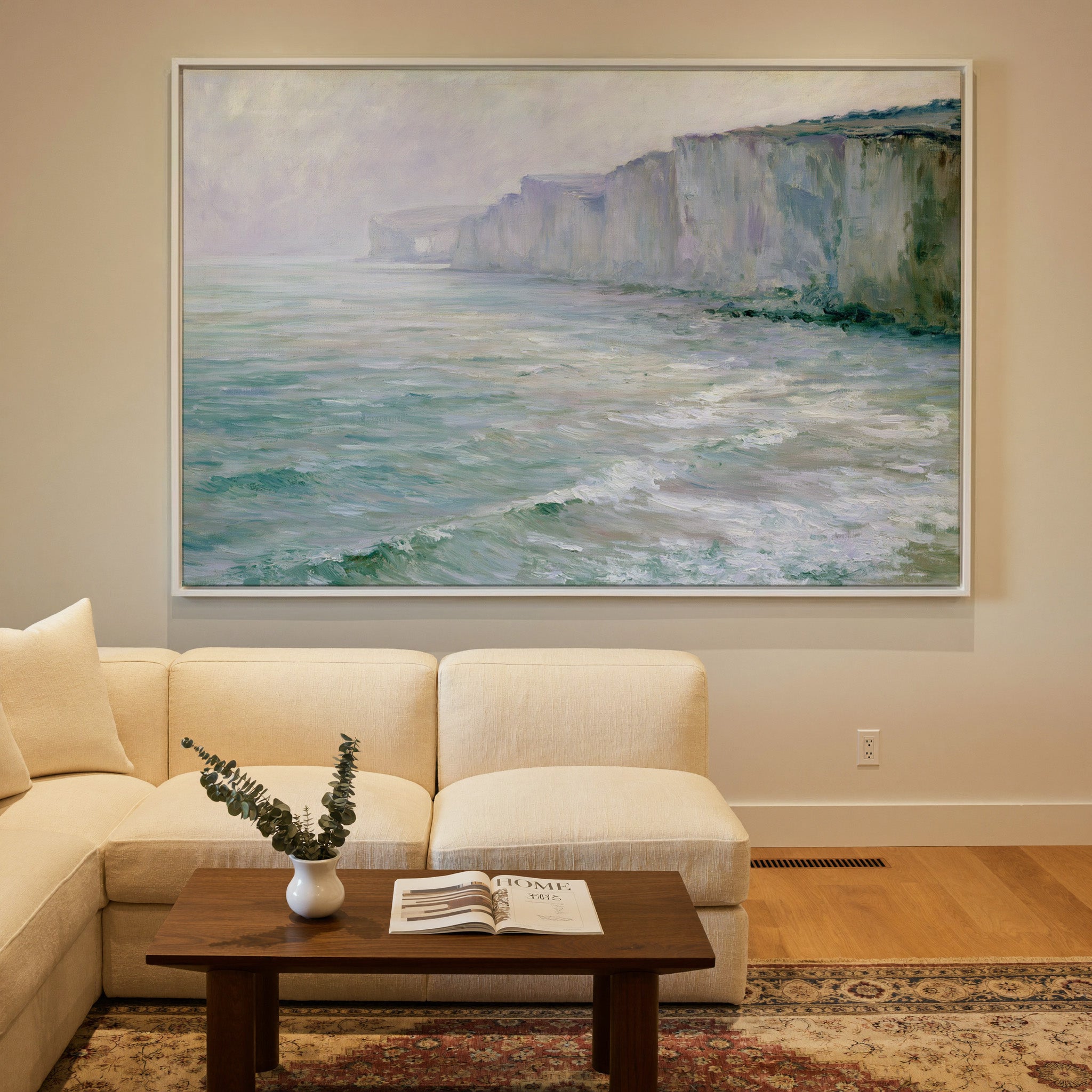 soft chalk cliffs above pale green sea canvas wall art in a white frame in a styled room setting