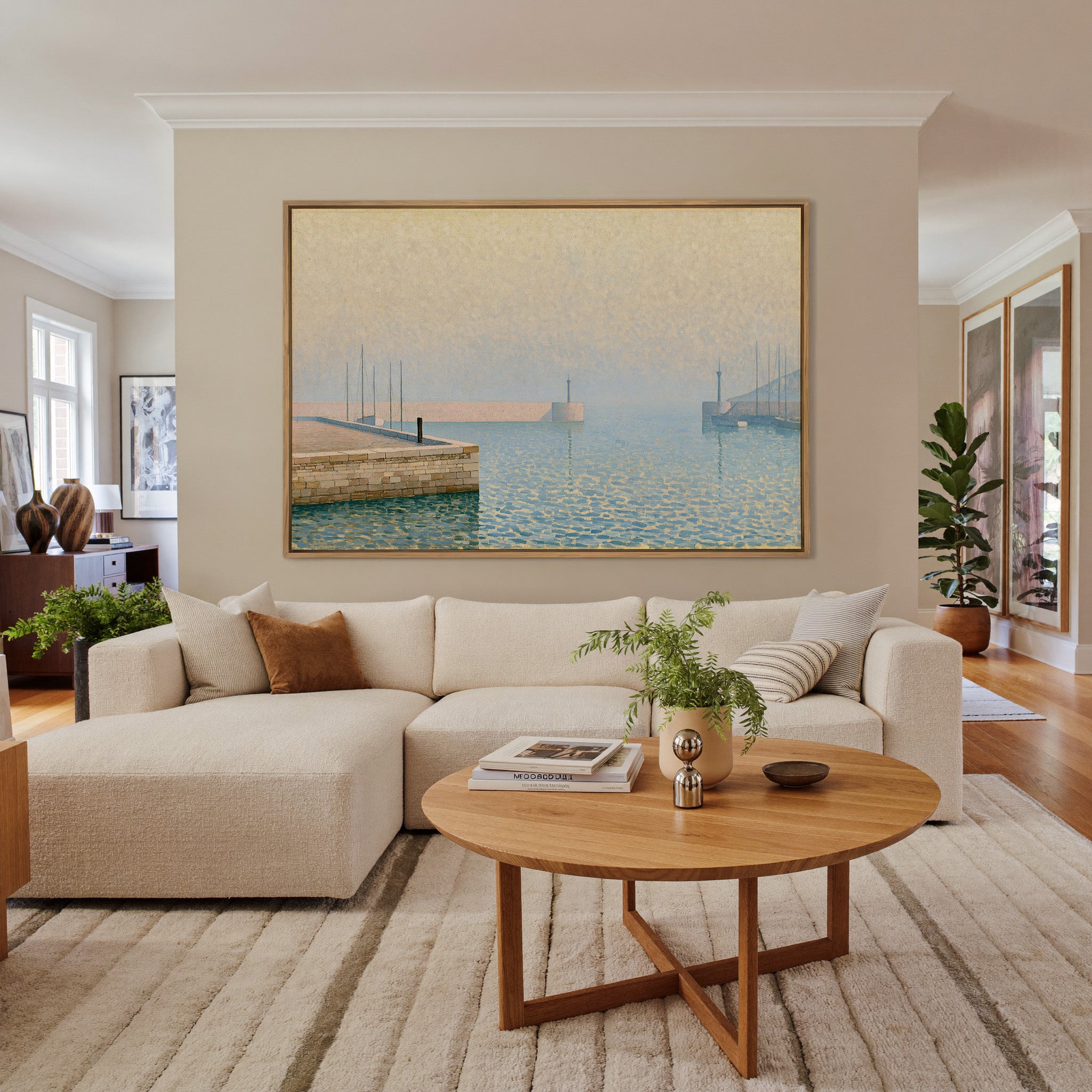 pale geometric harbor with stone pier and soft canvas wall art in an oak frame in a living room