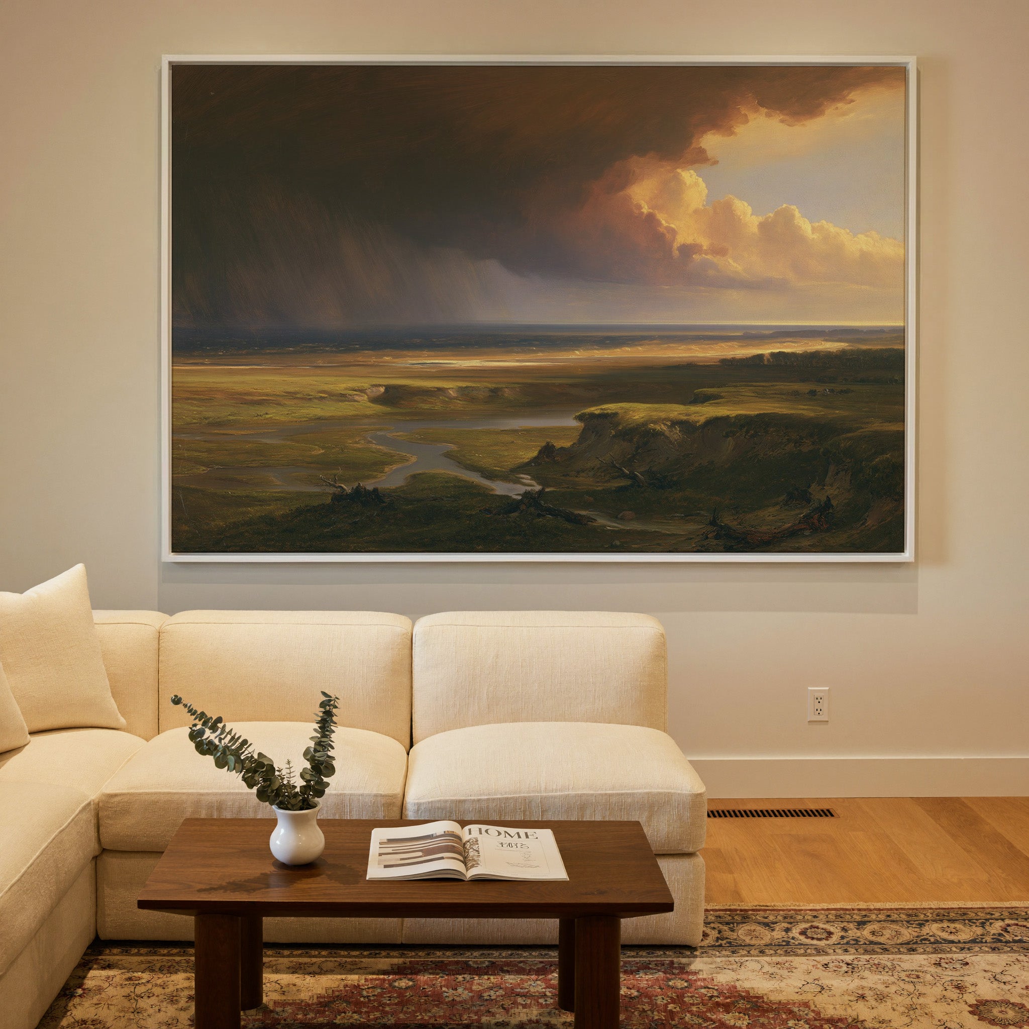storm light over a broad coastal plain canvas wall art in a white frame in a styled room setting