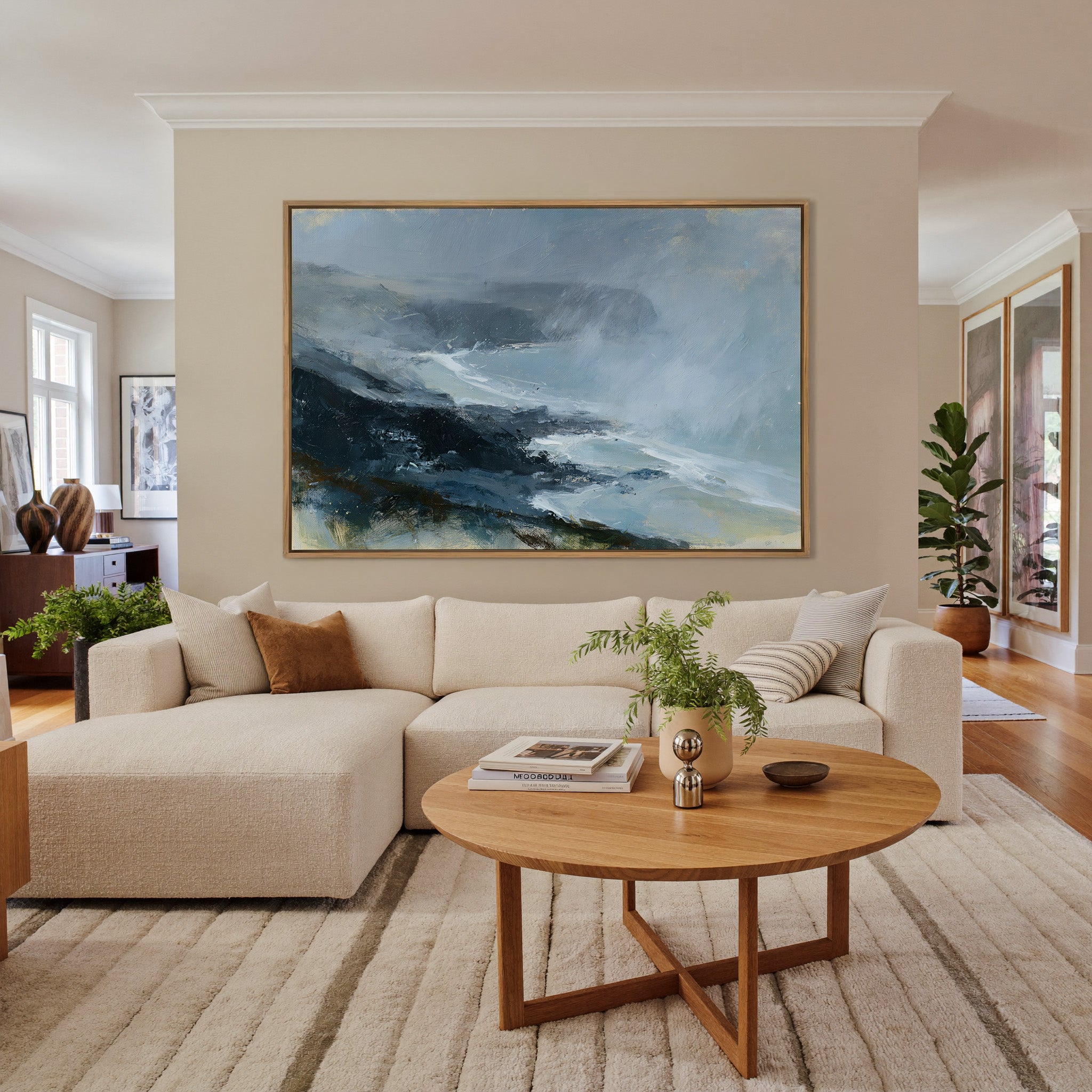 windswept coastal headland in rain and mist canvas wall art in an oak frame in a living room