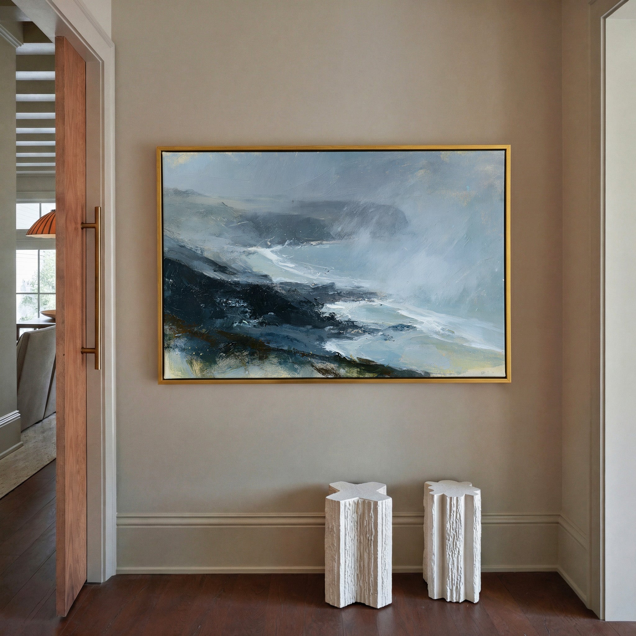 windswept coastal headland in rain and mist canvas wall art in a gold frame in a styled room setting