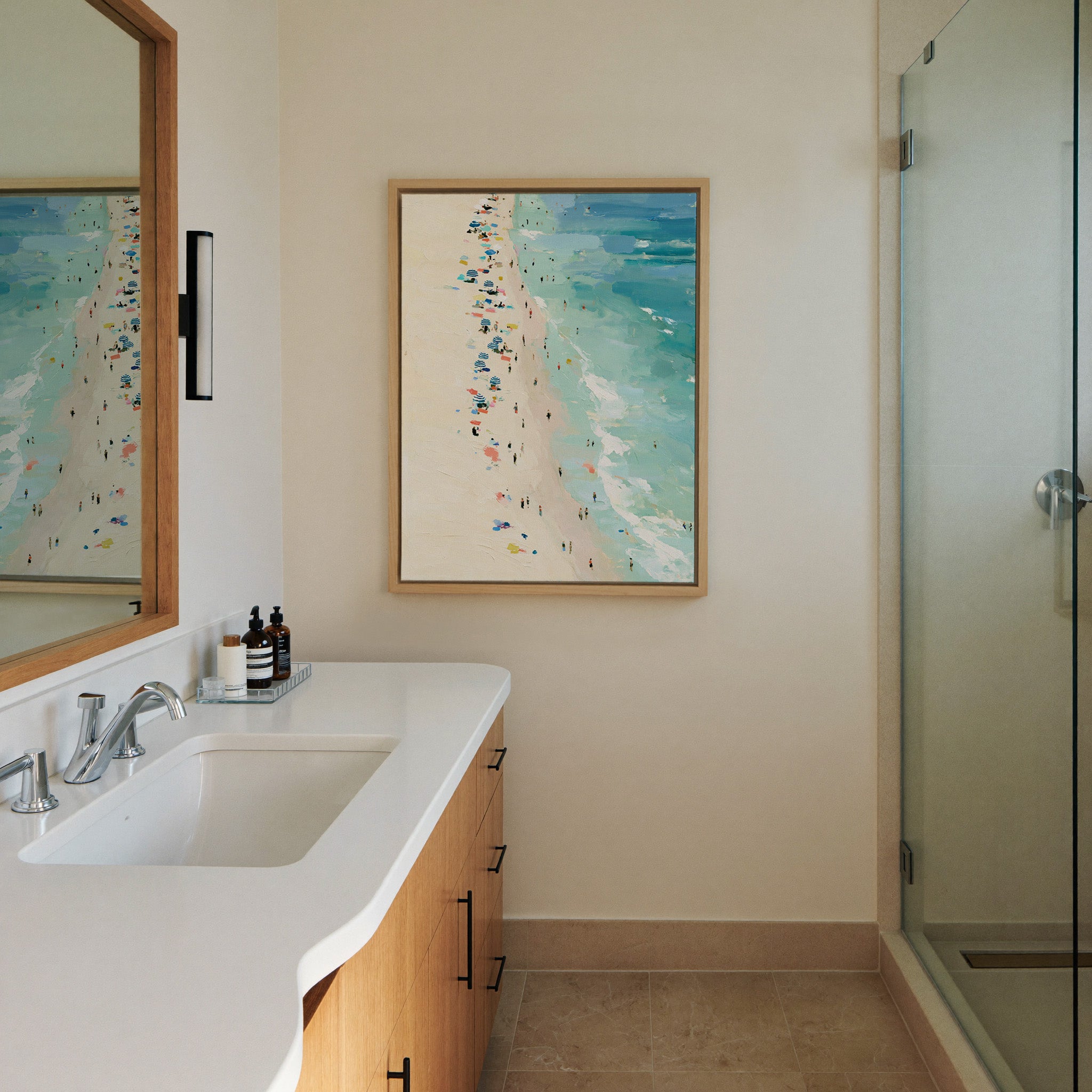 sunlit beach with turquoise water canvas wall art in a natural wood frame in a styled room setting