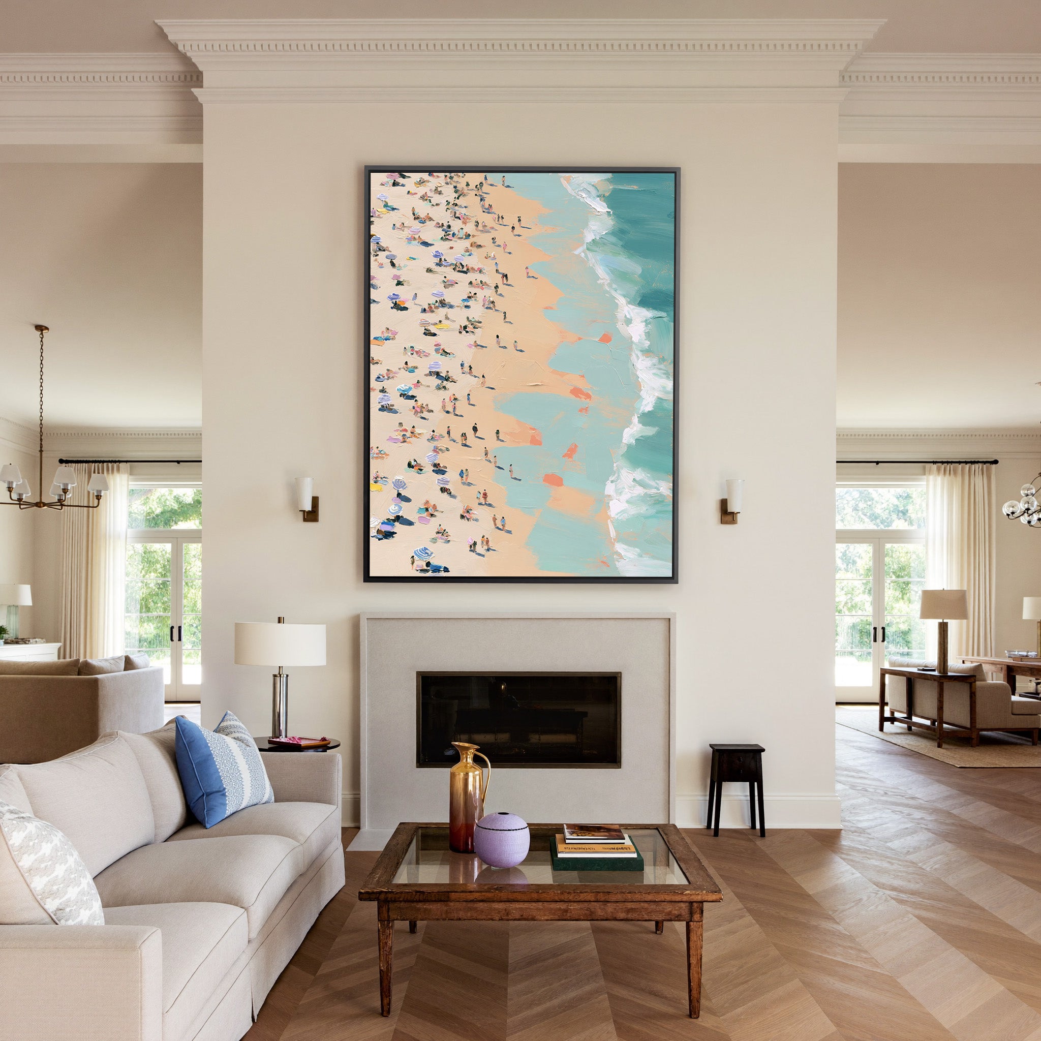 sunlit beach with turquoise surf and scattered canvas wall art in a black frame above a mantel