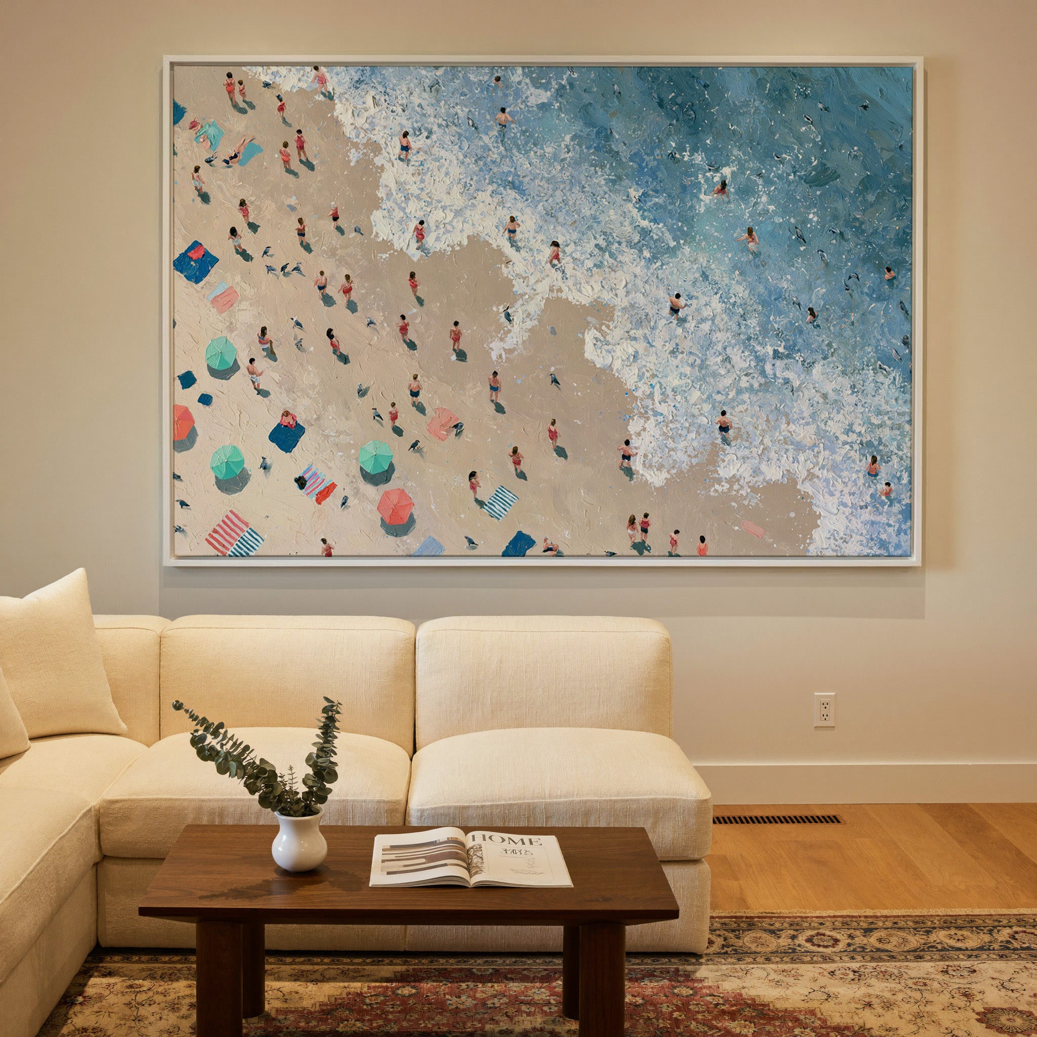 diagonal shoreline with swimmers and umbrellas canvas wall art in a white frame in a styled room setting