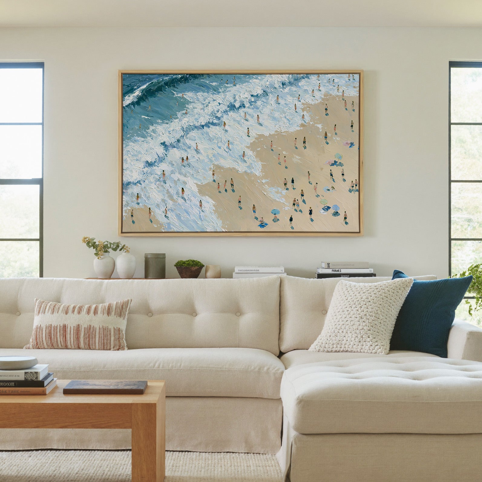 diagonal shoreline with white surf and small canvas wall art in a natural wood frame in a living room
