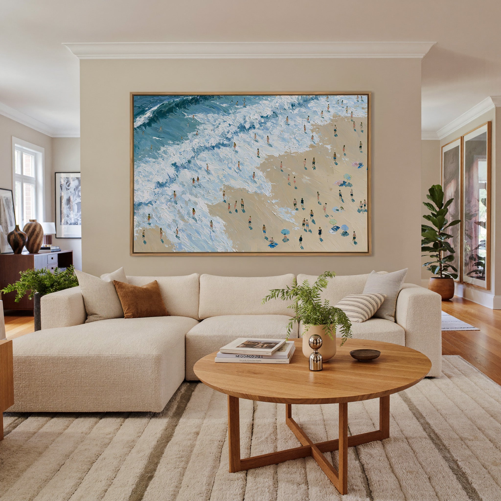 diagonal shoreline with white surf and small canvas wall art in an oak frame in a living room