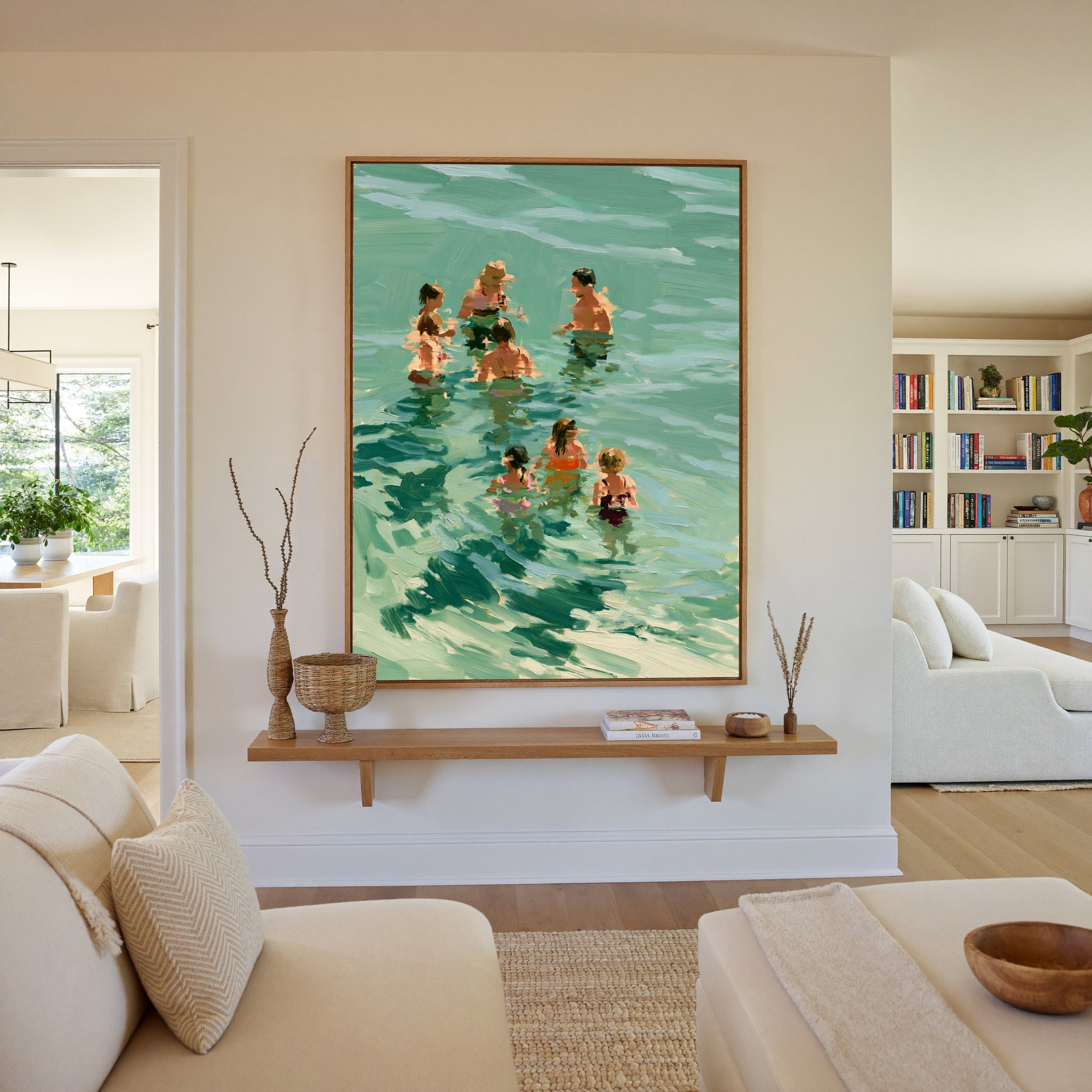 group of bathers in translucent green water canvas wall art in an oak frame in a living room