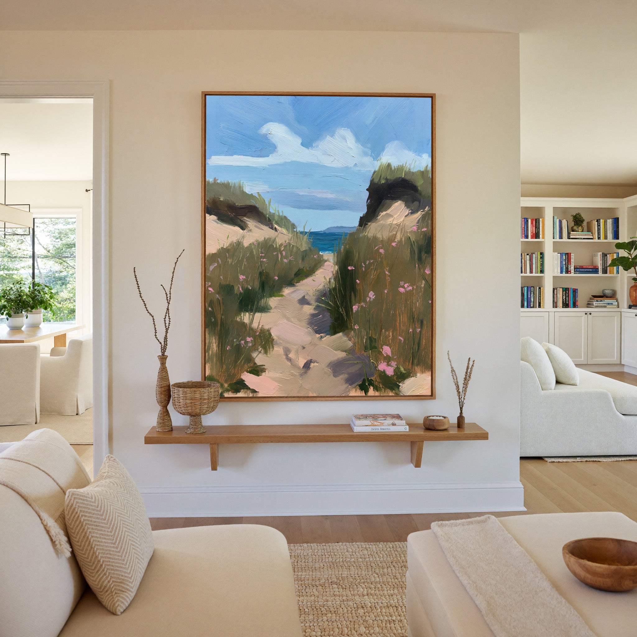 windswept coastal path with dune grass and pink canvas wall art in an oak frame in a living room