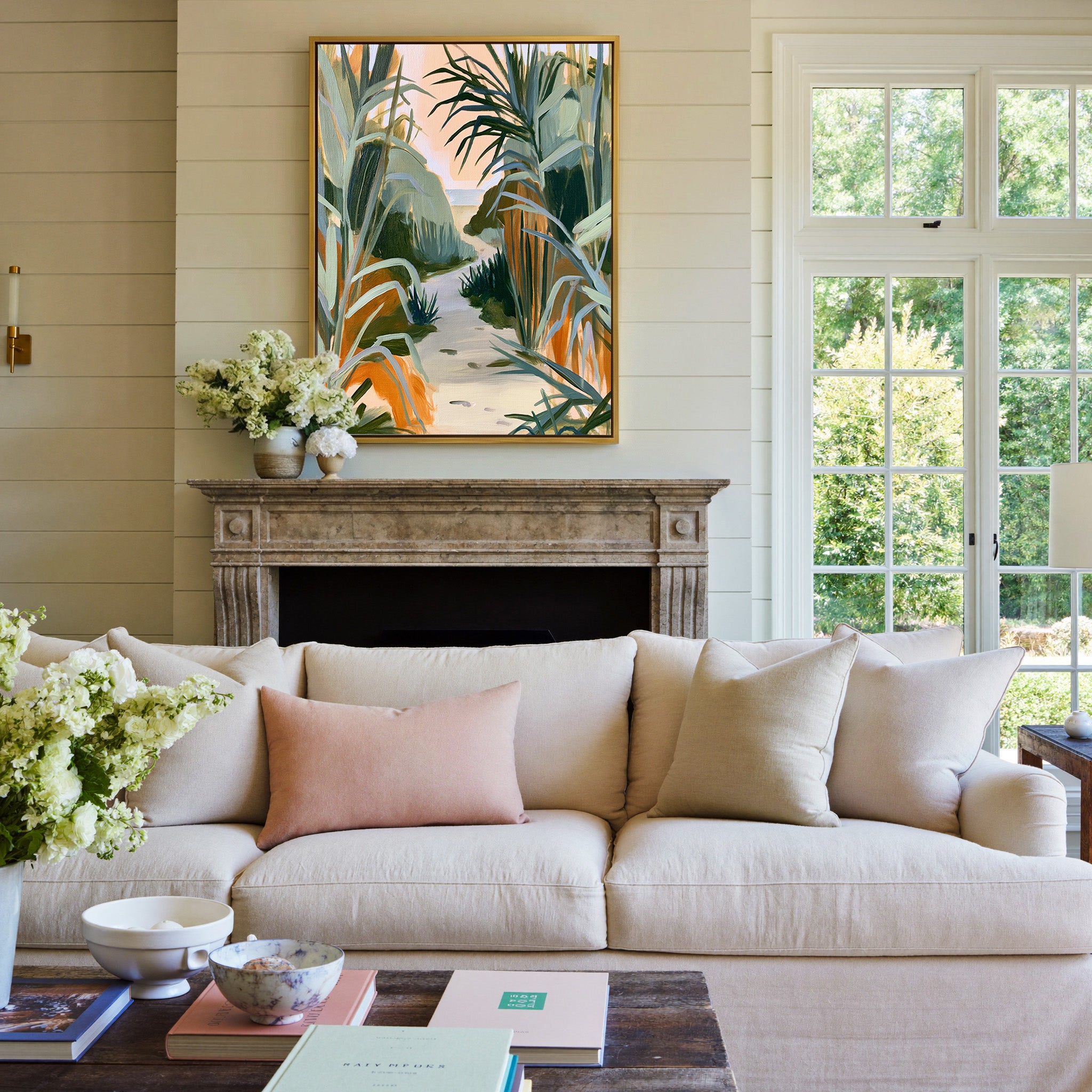 sandy path between tall coastal grasses canvas wall art in a gold frame above a mantel