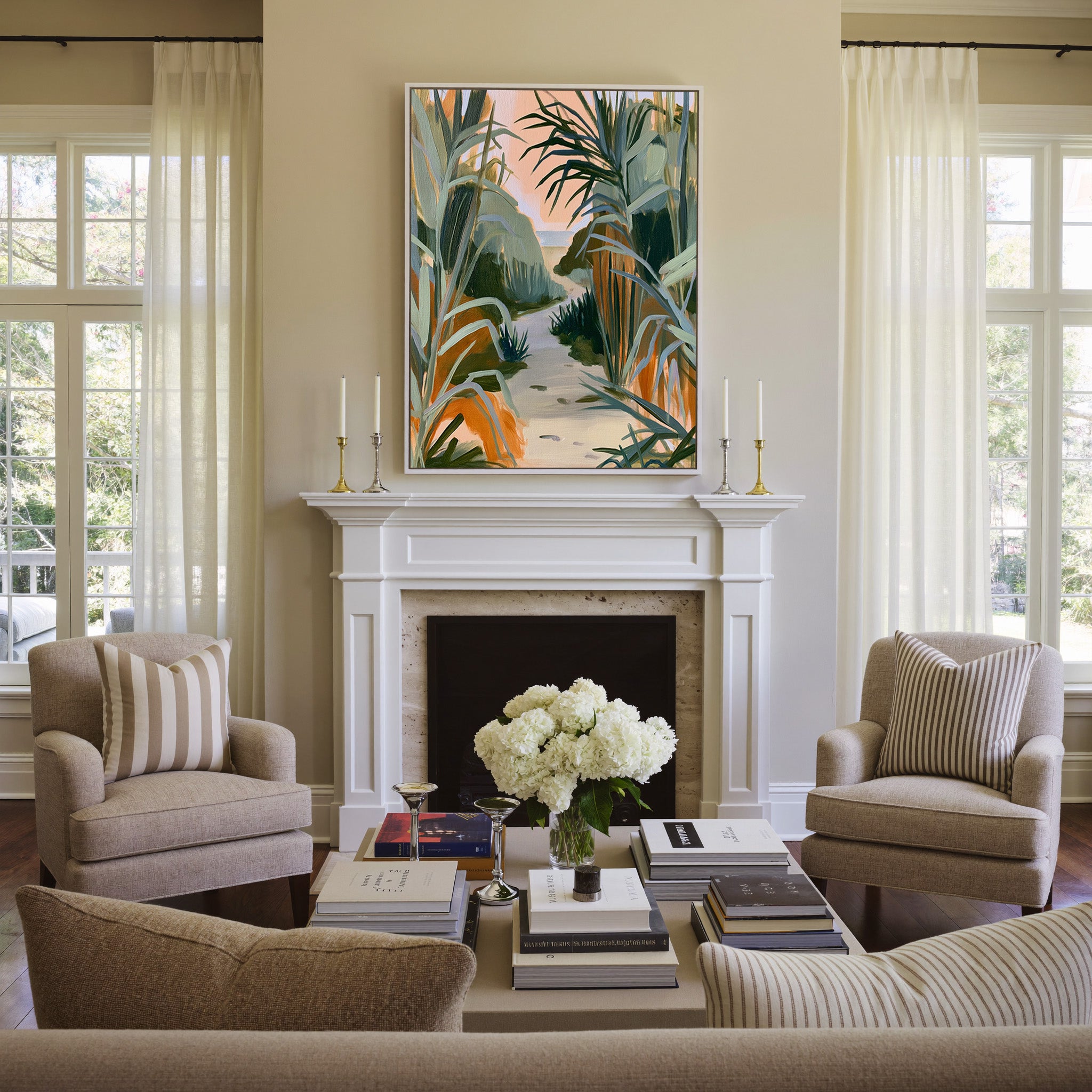 sandy path between tall coastal grasses canvas wall art in a white frame above a mantel