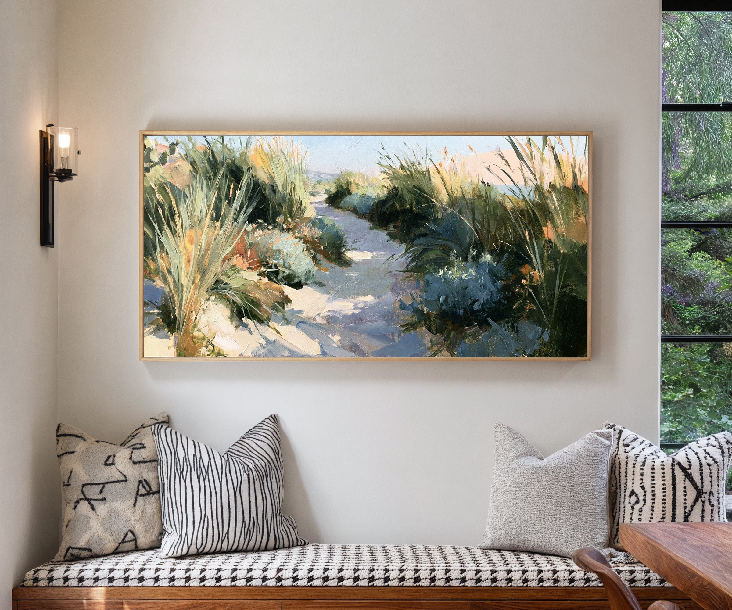 sandy path between tall coastal grasses canvas wall art in a natural wood frame in a living room