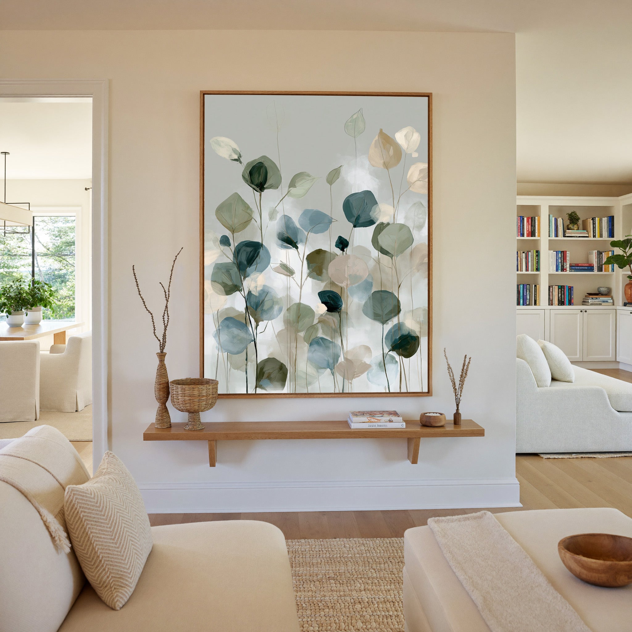 soft eucalyptus like leaves in muted green, canvas wall art in an oak frame in a living room