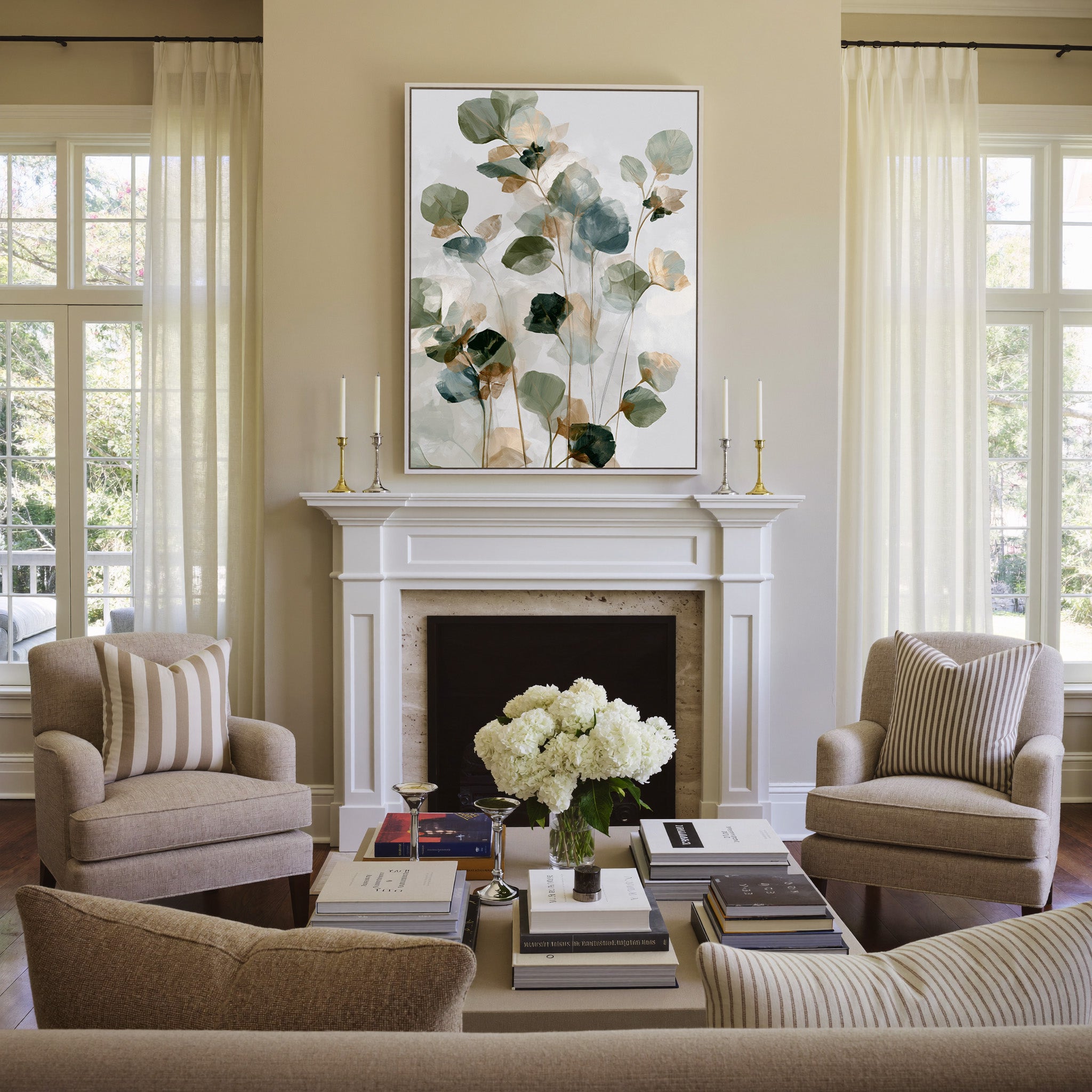 soft eucalyptus like leaves in sage, blue gray, canvas wall art in a white frame above a mantel