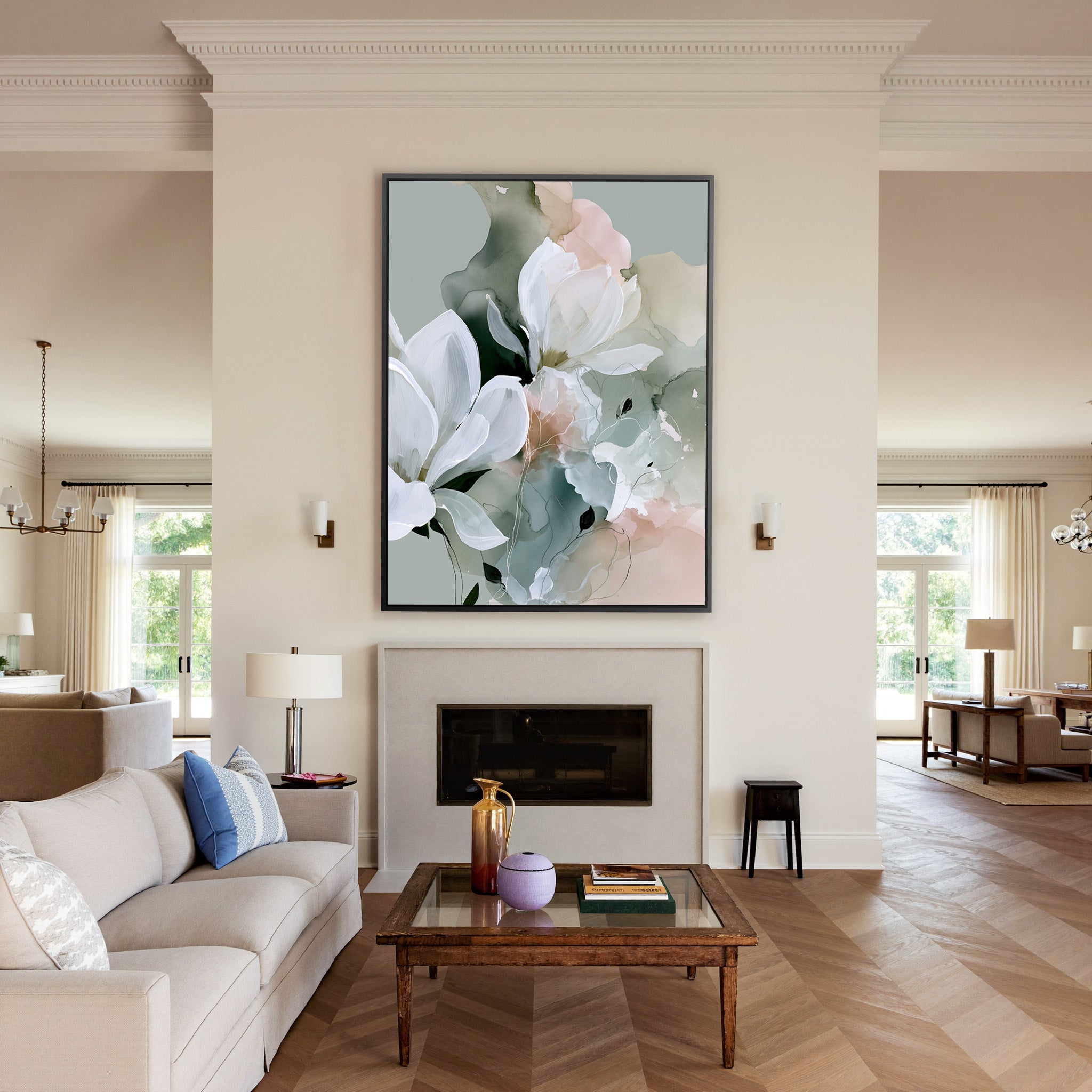 white blossoms over sage and blush layers canvas wall art in a black frame above a mantel