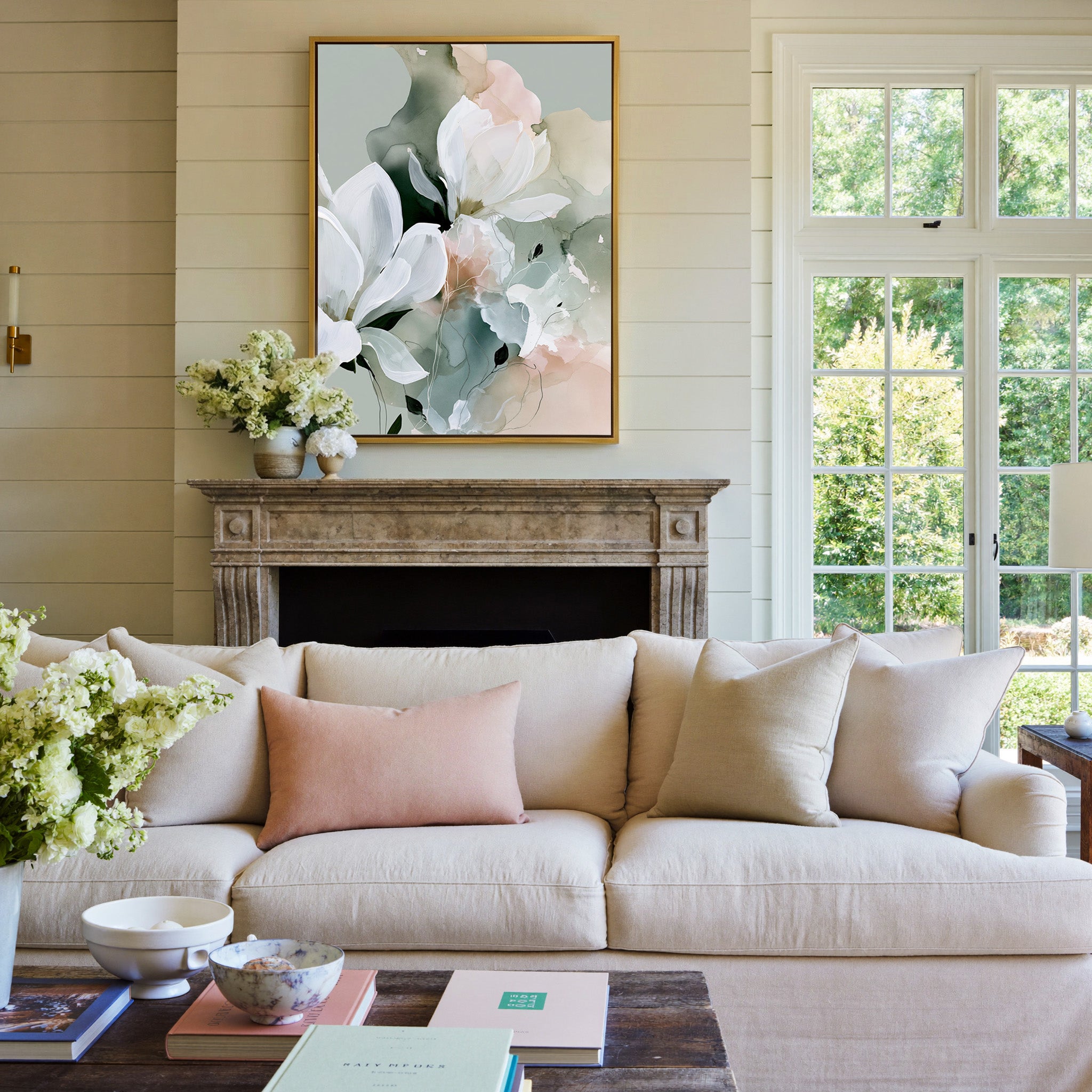 white blossoms over sage and blush layers canvas wall art in a gold frame above a mantel