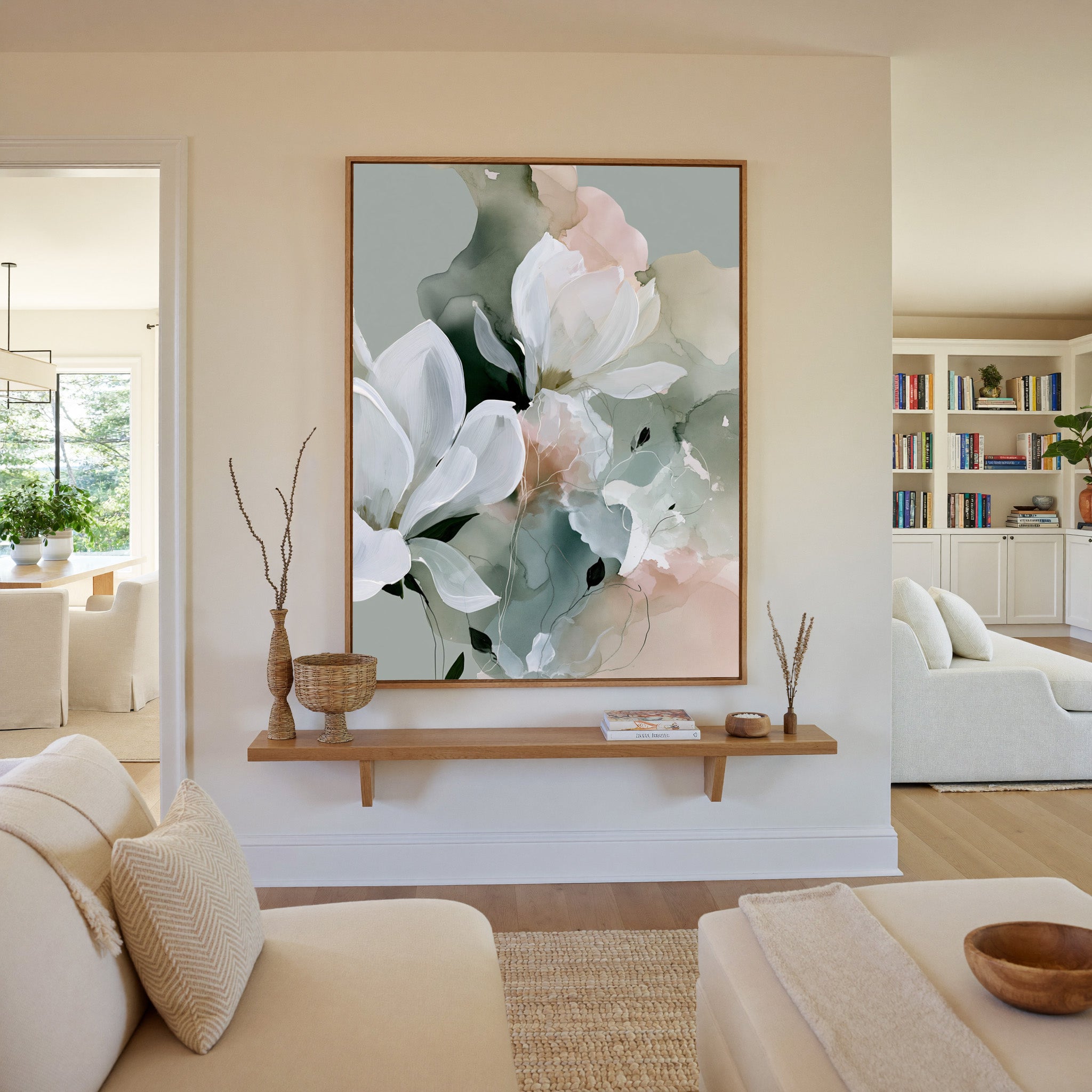 white blossoms over sage and blush layers canvas wall art in an oak frame in a living room