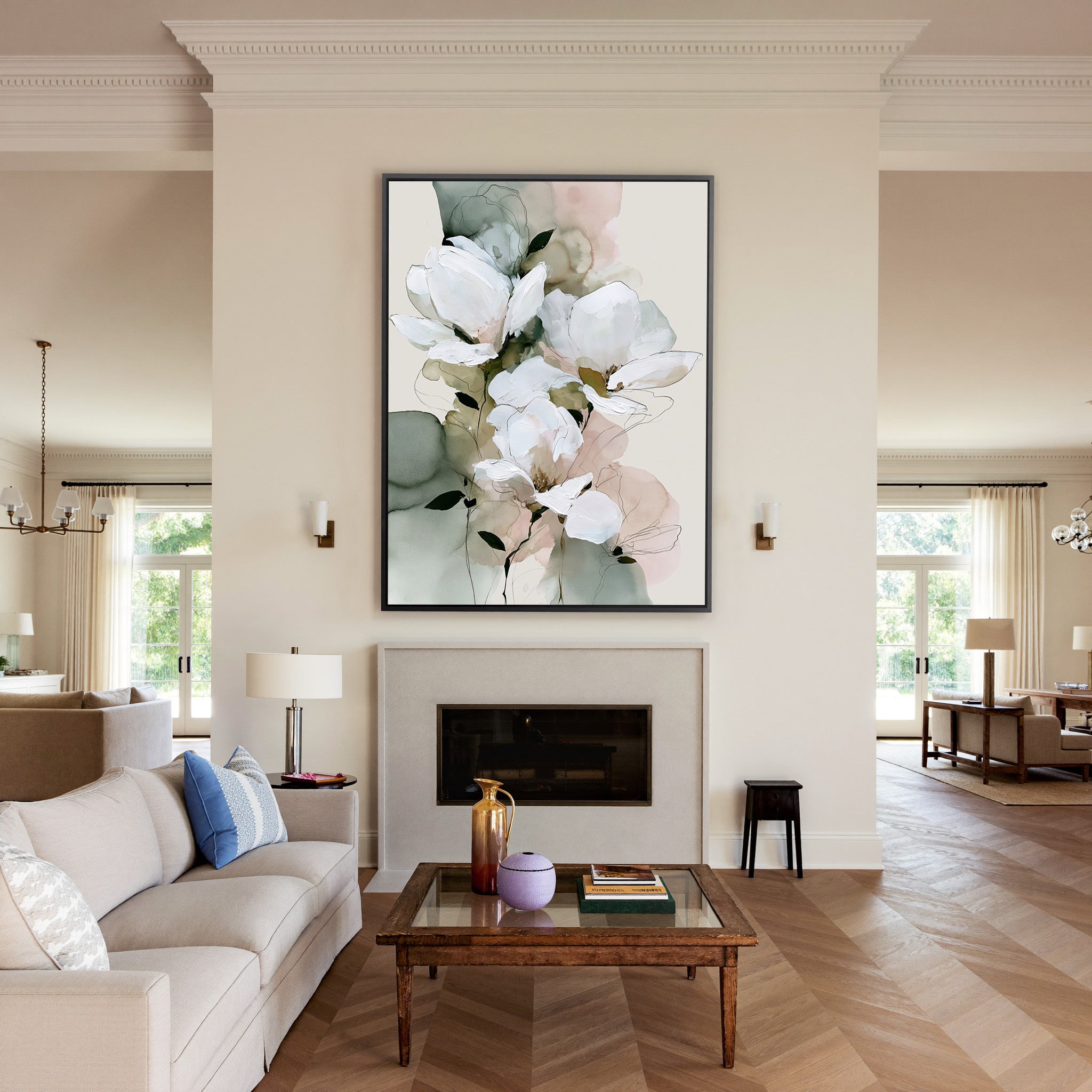 white magnolia like blooms with sage and blush canvas wall art in a black frame above a mantel