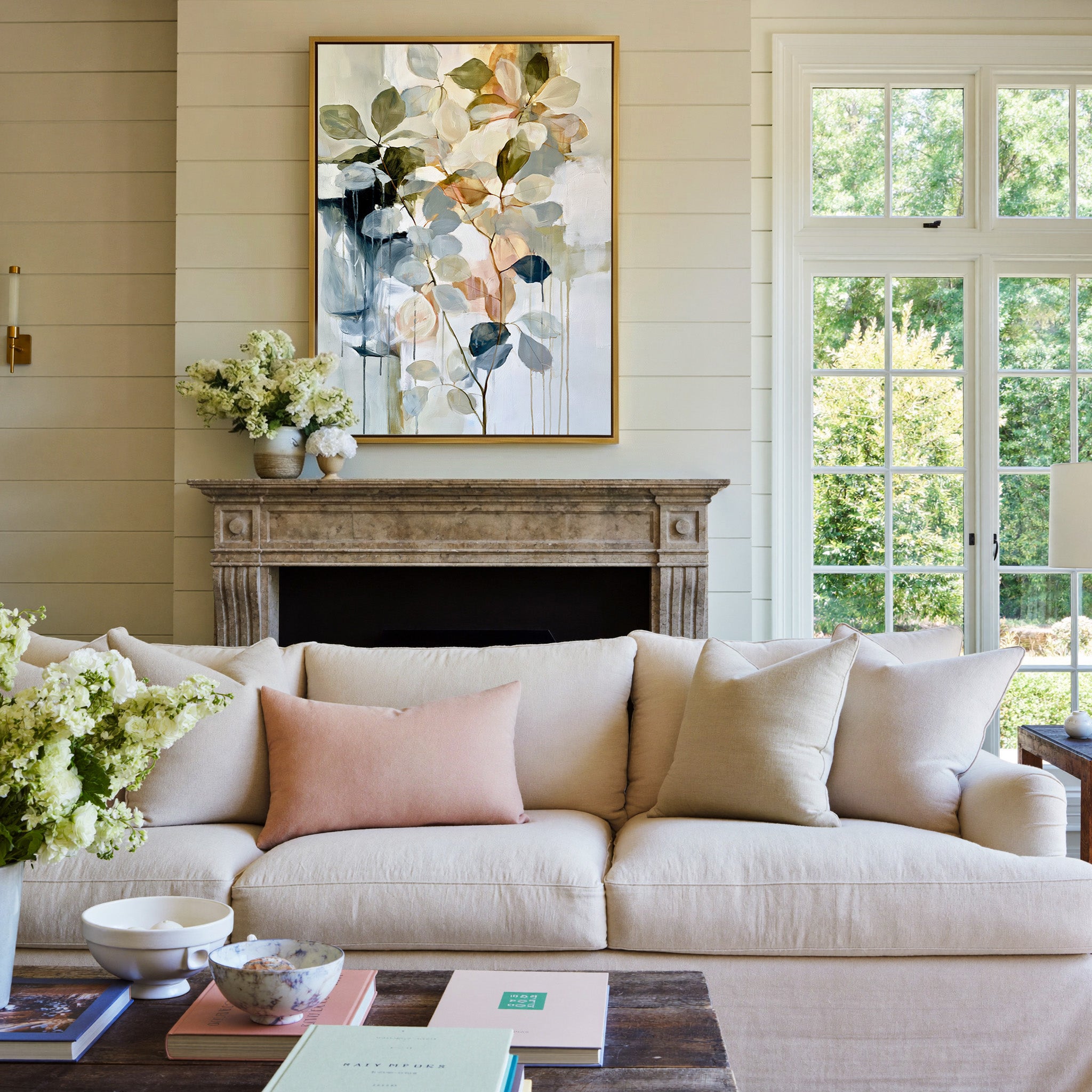 soft eucalyptus like leaves in cream, sage, canvas wall art in a gold frame above a mantel