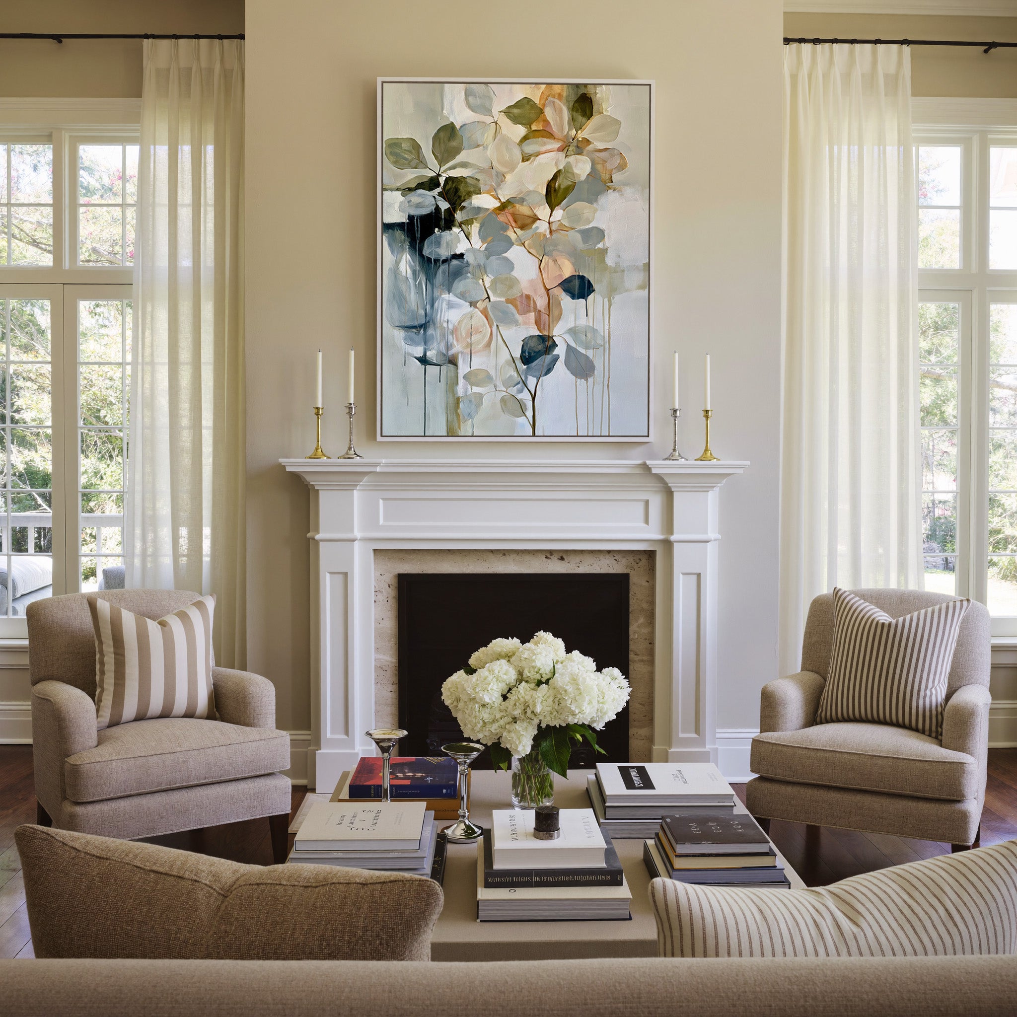 soft eucalyptus like leaves in cream, sage, canvas wall art in a white frame above a mantel