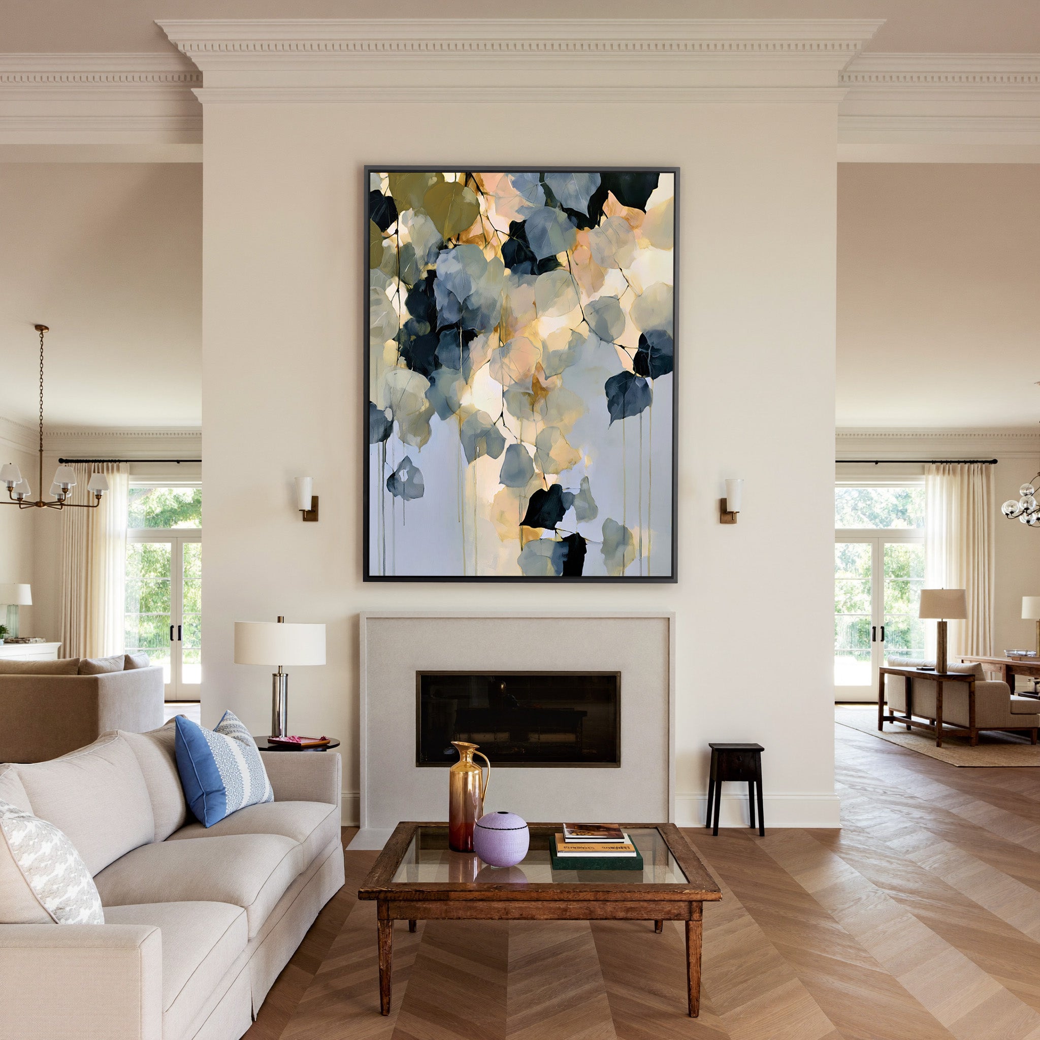 soft blue gray and gold abstract with hanging canvas wall art in a black frame above a mantel