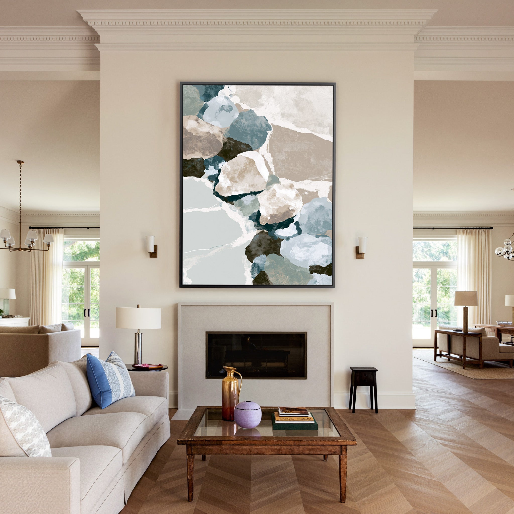 muted coastal abstract with oyster shell shapes canvas wall art in a black frame above a mantel