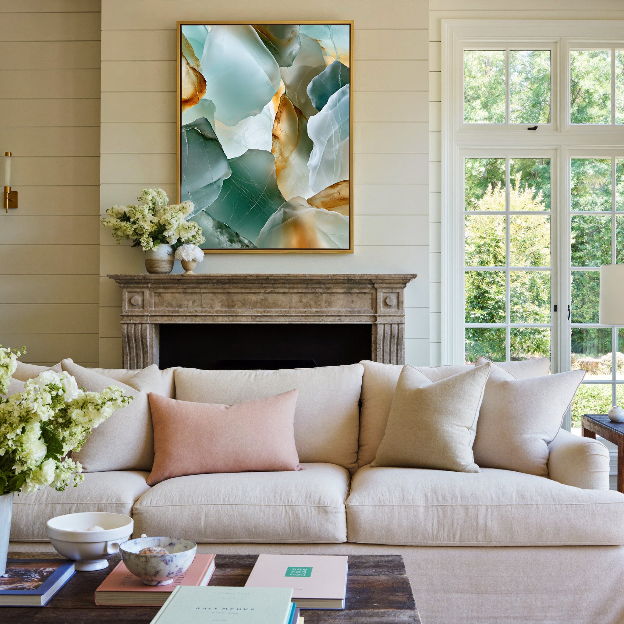 sea glass abstract in aqua, sage, white, and canvas wall art in a gold frame above a mantel