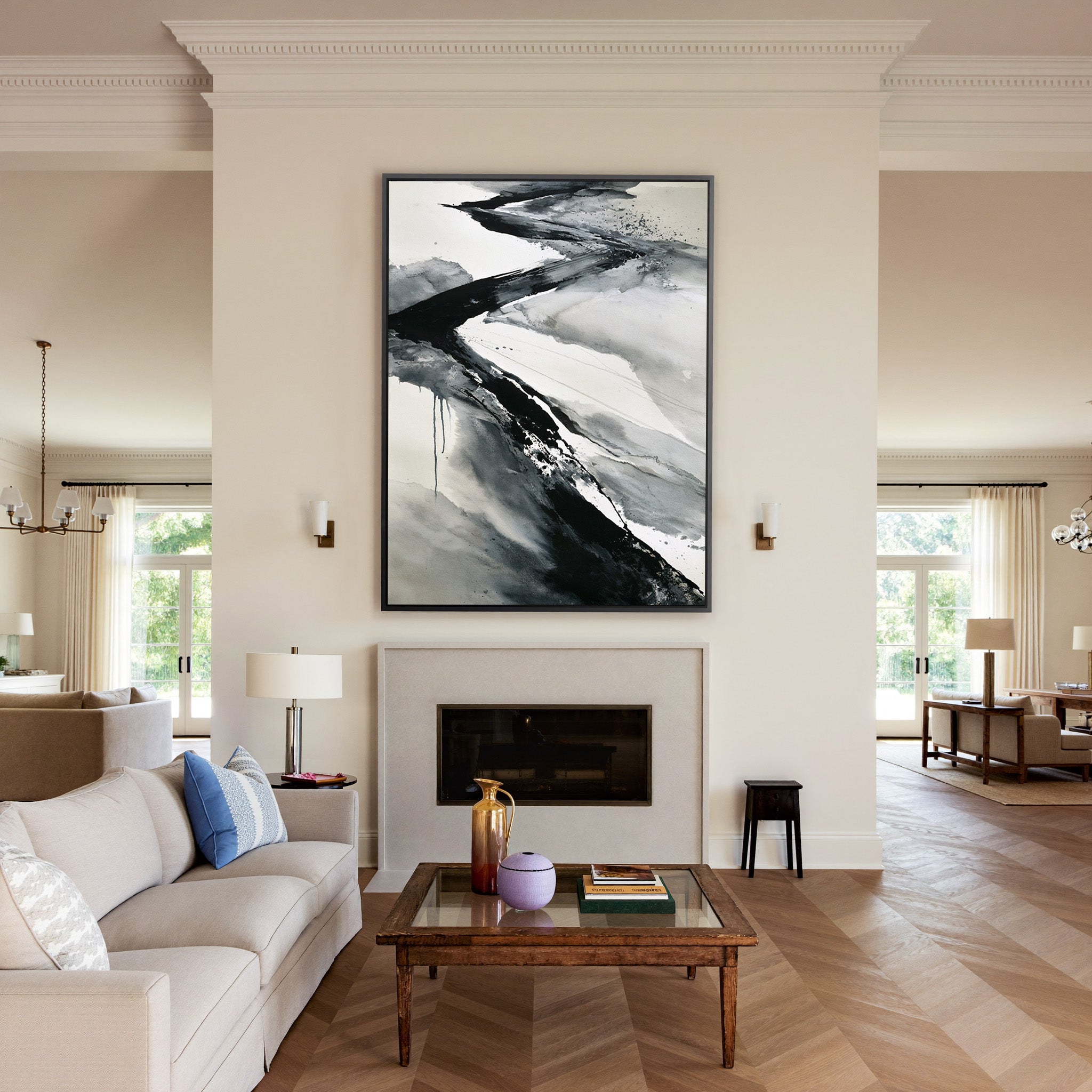 black and gray flowing abstract canvas wall art in a black frame above a mantel