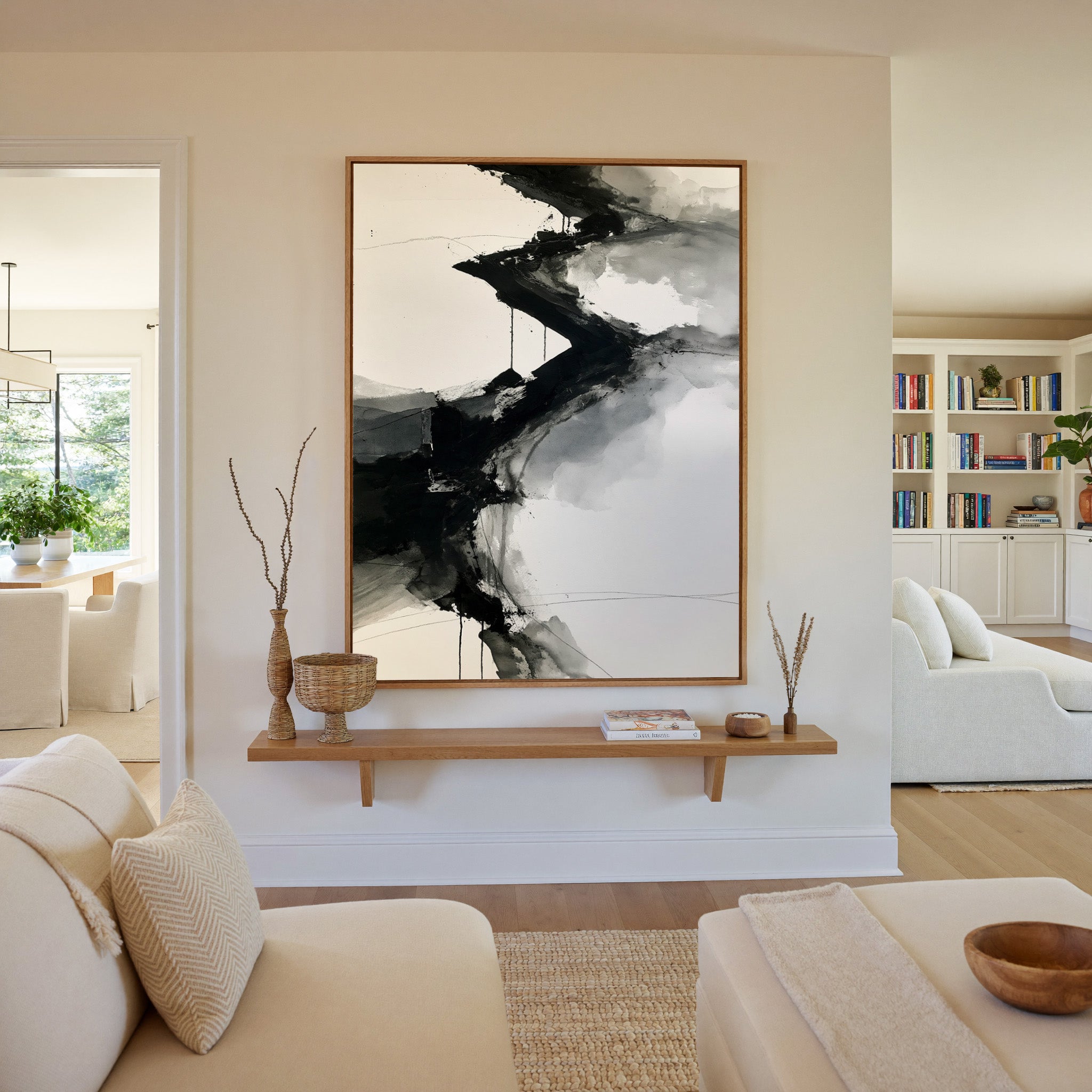 monochrome abstract with diagonal black bands canvas wall art in an oak frame in a living room